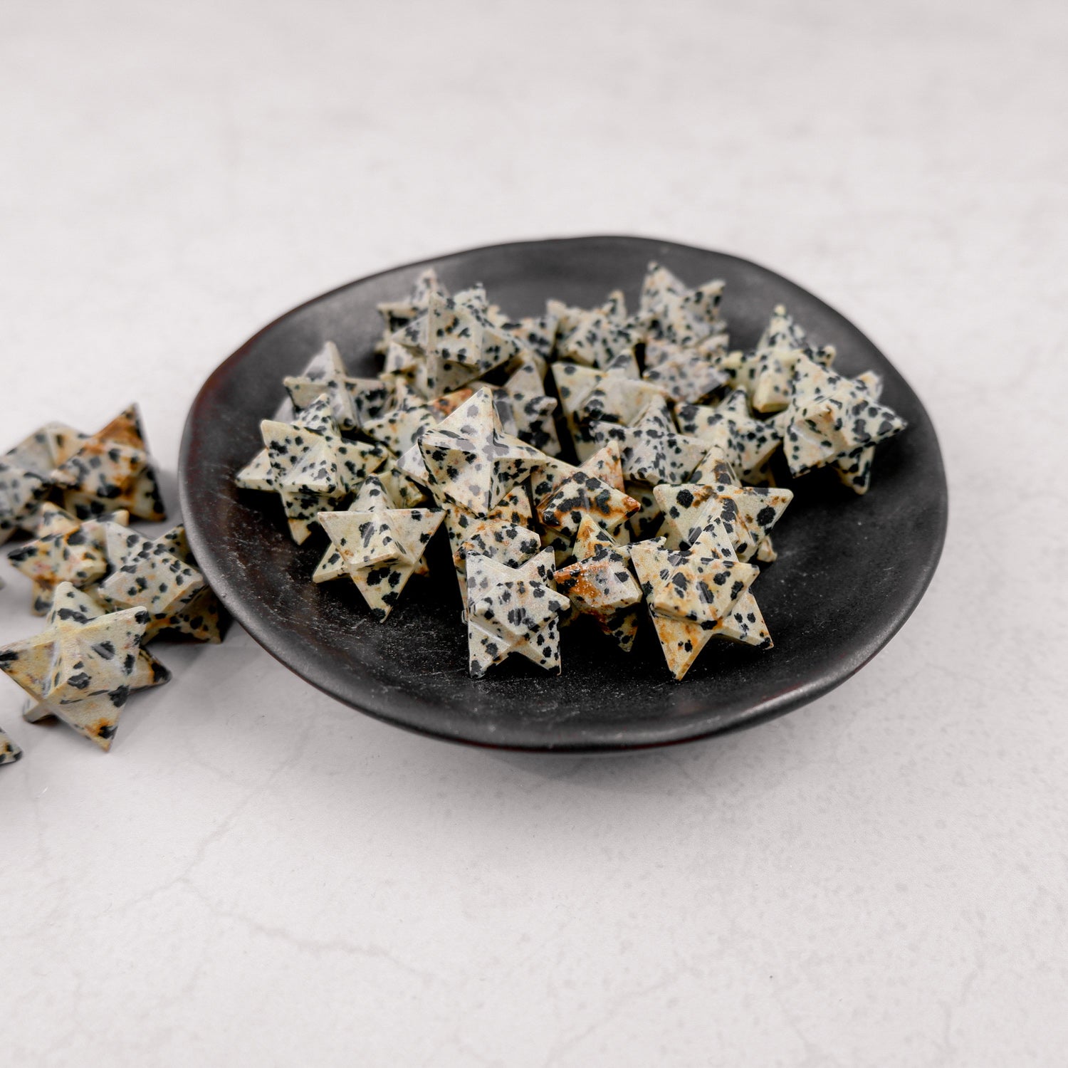 Dalmatian Star by Noctis Studio, a star-shaped decorative item with black and white spotted pattern, displayed against a plain background.