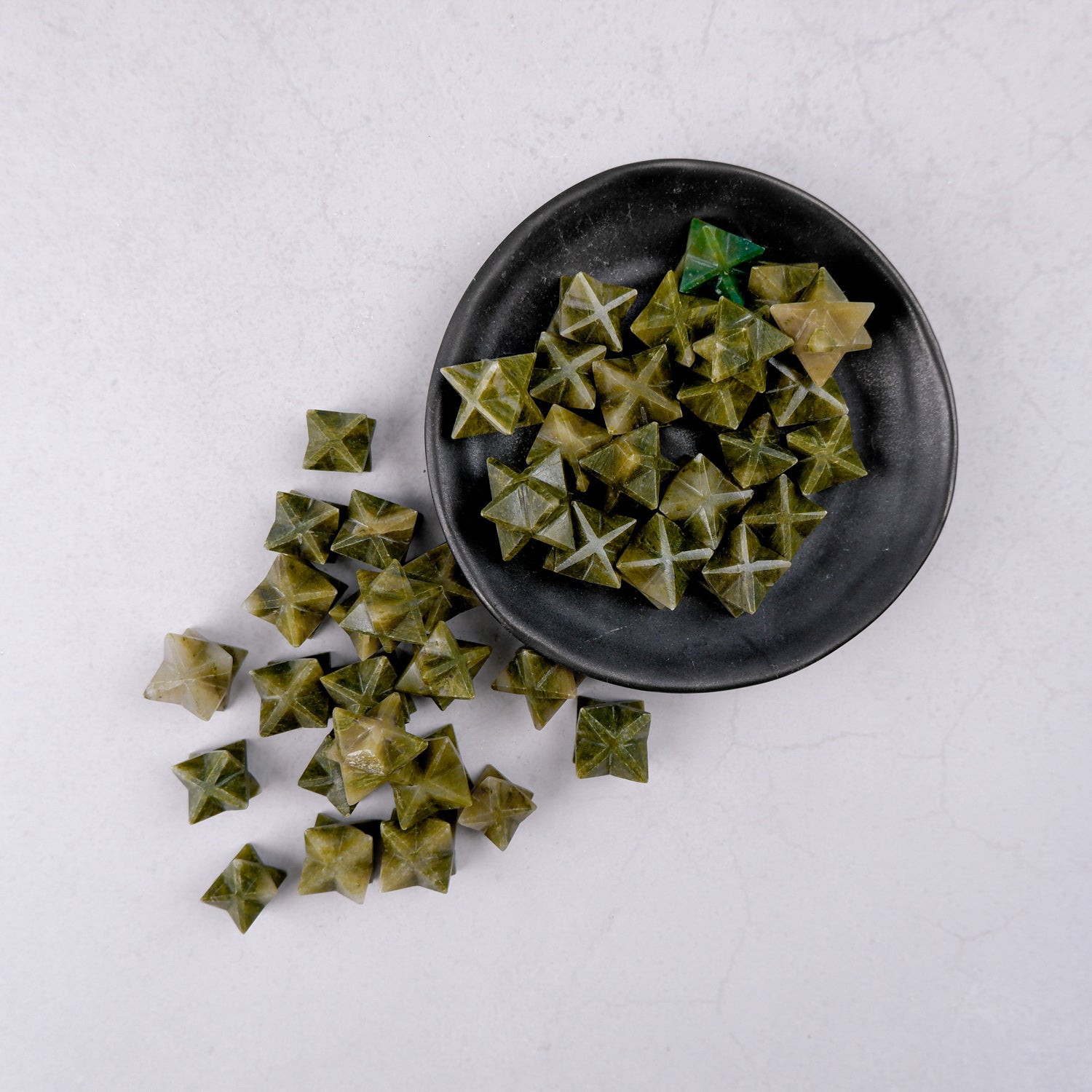Green Jasper star sculpture by Noctis Studio with polished, vibrant green stone and star-shaped design.