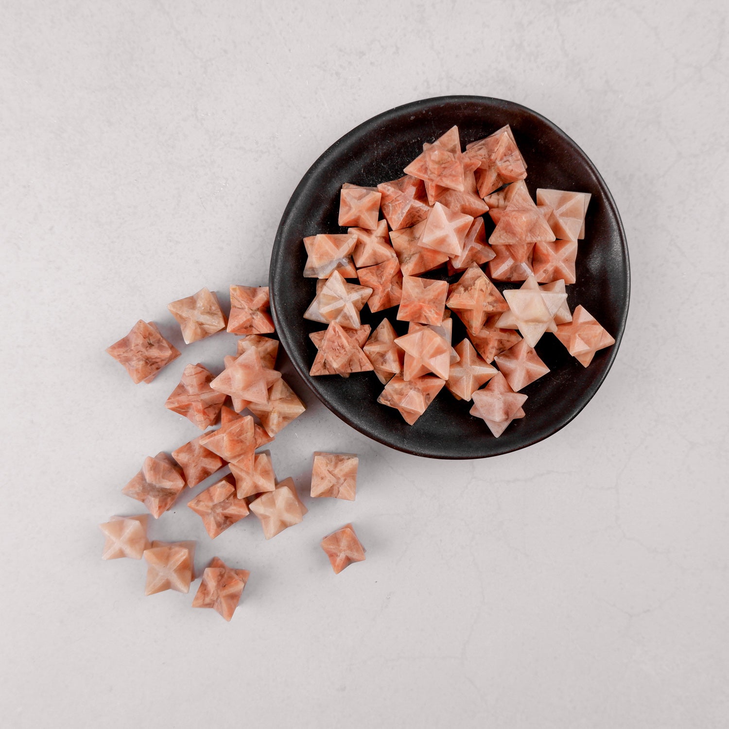 Orange Moonstone Star jewelry piece by Noctis Studio featuring a polished star-shaped orange moonstone gemstone.