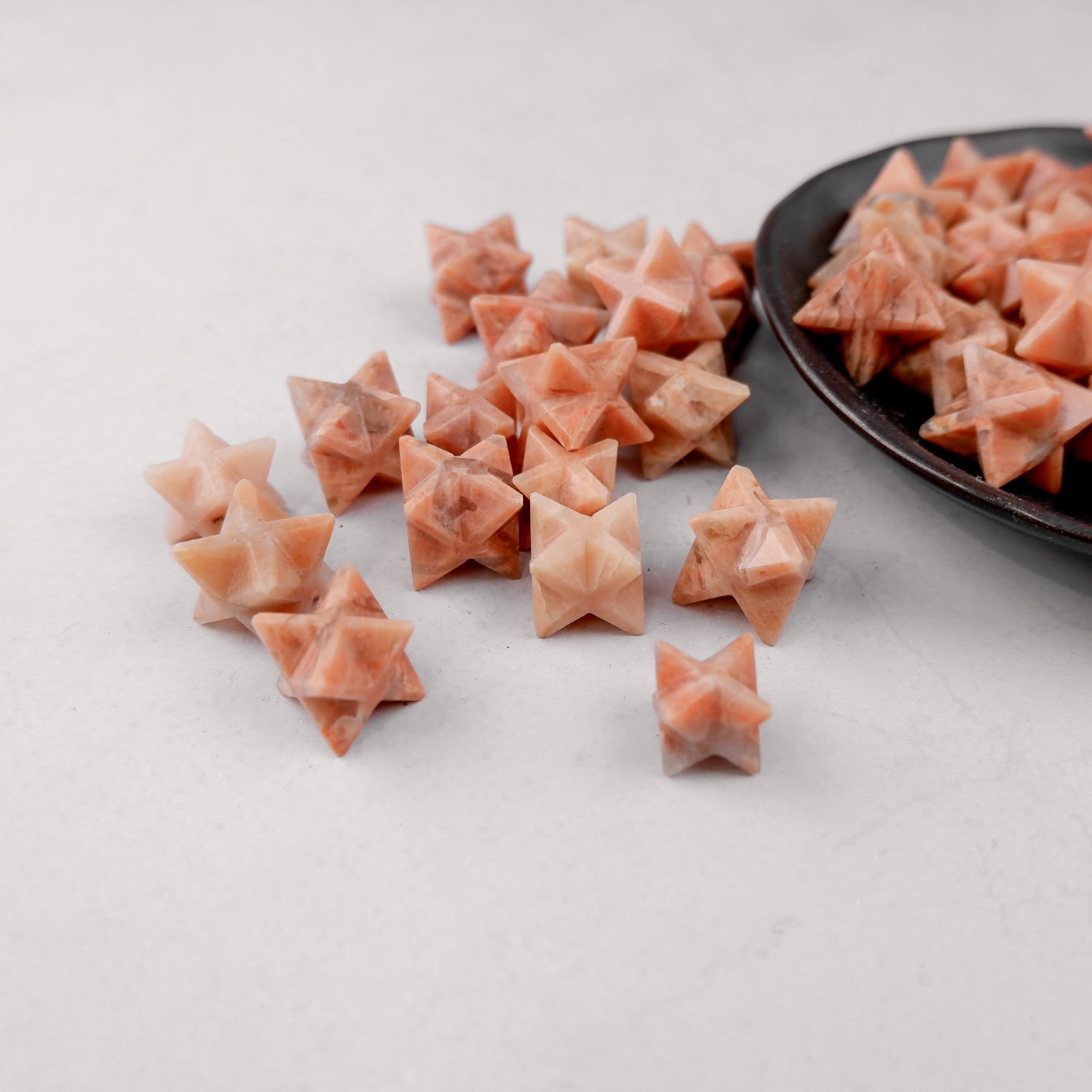 Orange Moonstone Star pendant from Noctis Studio featuring a polished star-shaped gemstone with vibrant orange hues.
