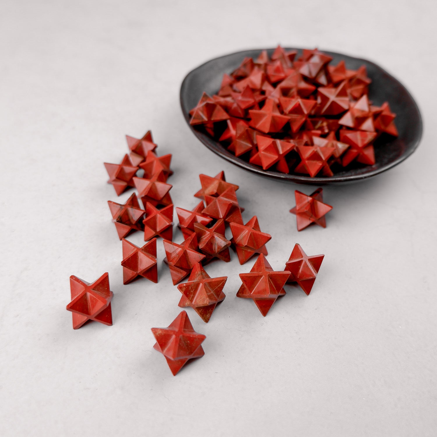 Red Jasper Star by Noctis Studio, polished gemstone with a star shape, showcasing deep red hues and natural stone patterns.