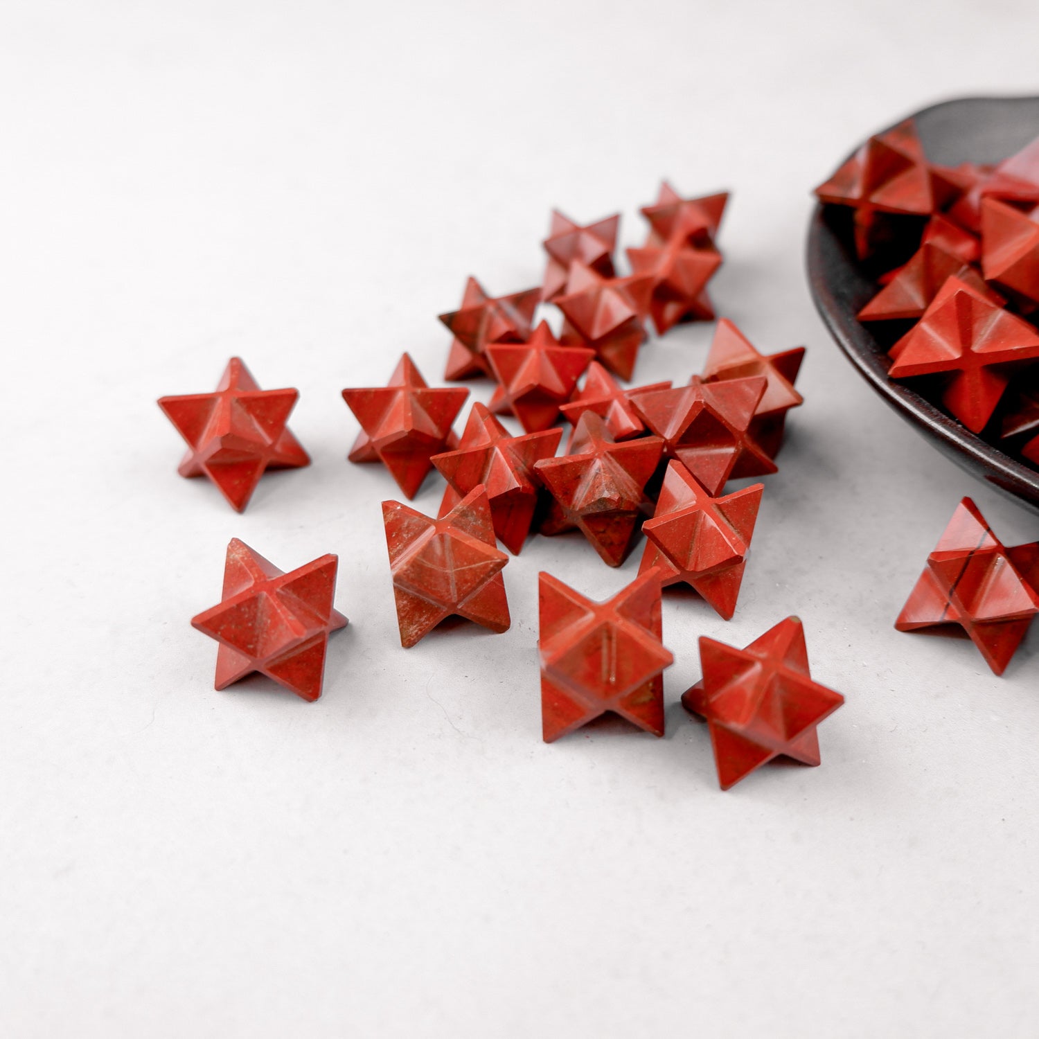 Red Jasper star gemstone from Noctis Studio, polished red jasper with star shape, smooth surface and vibrant color.