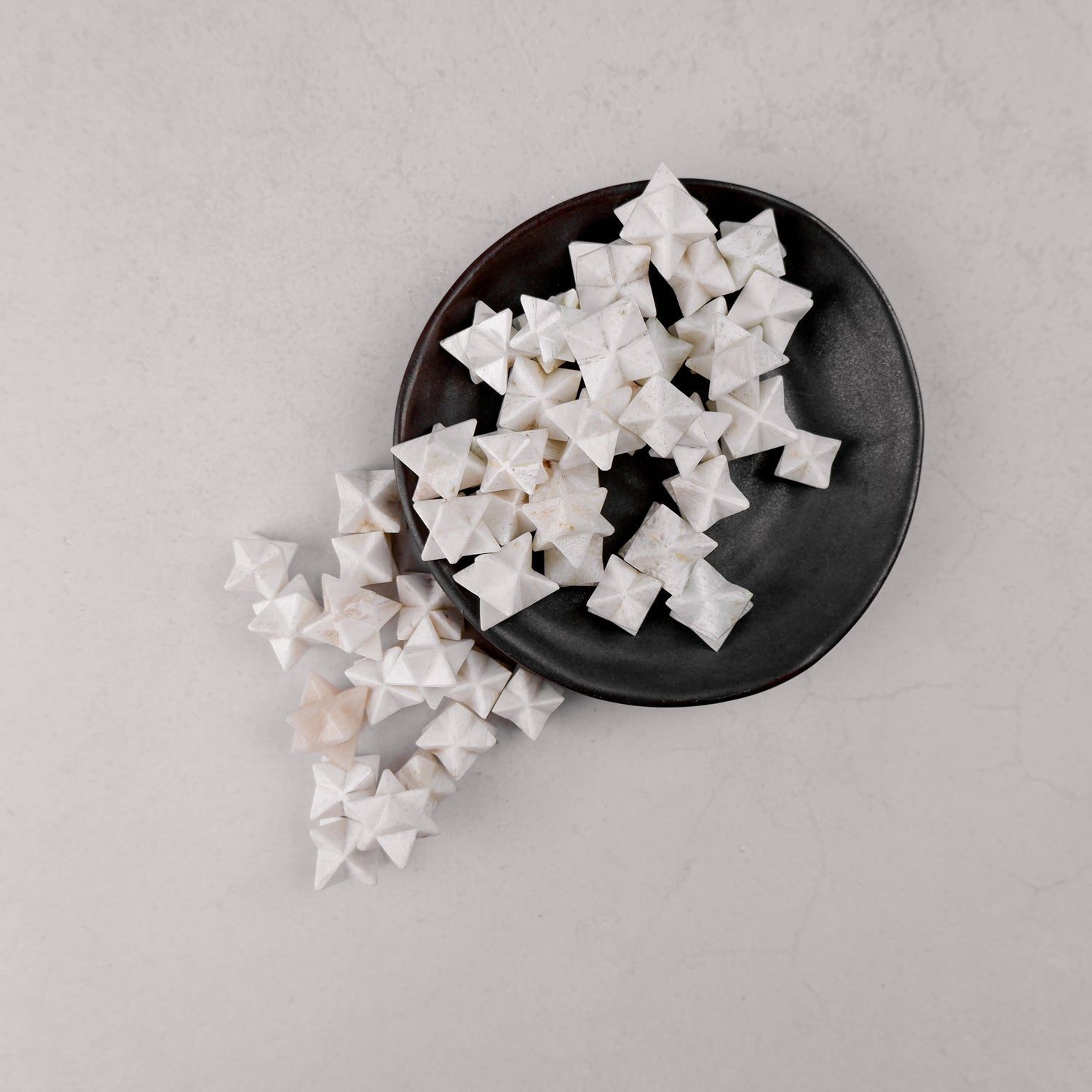 Scolecite star mineral specimen from Noctis Studio, showing a translucent star-shaped crystal with delicate natural formations.