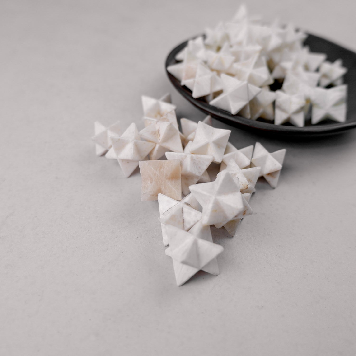 Scolecite star mineral specimen from Noctis Studio with a polished, star-shaped crystalline formation.