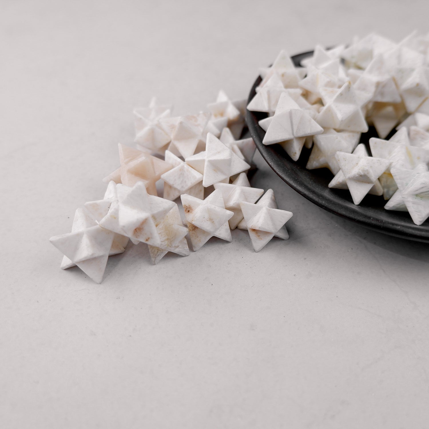 Noctis Studio Scolecite Star mineral specimen with a star-shaped crystal formation and translucent white appearance.