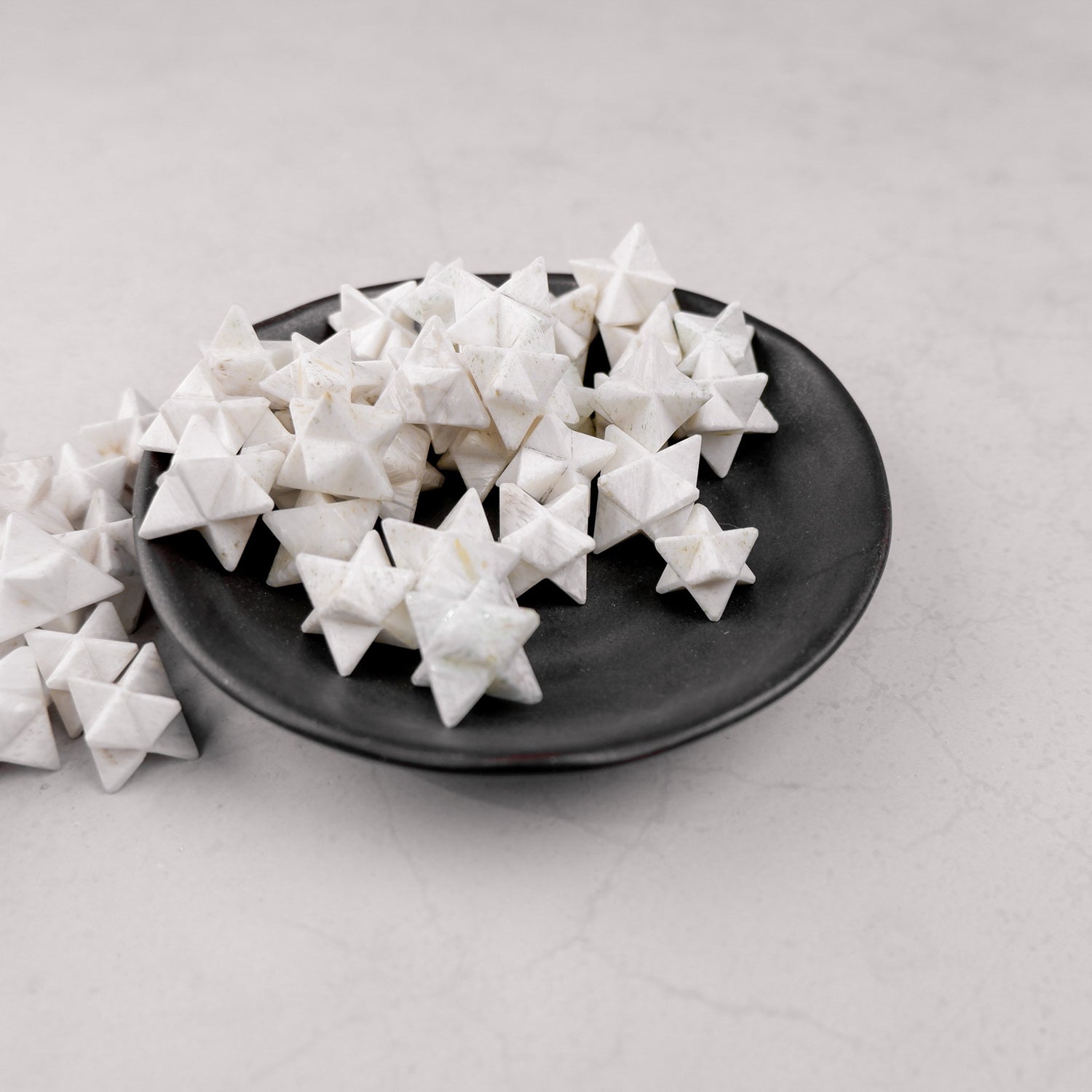 Scolecite Star mineral specimen from Noctis Studio showcasing a star-shaped crystal with white and translucent features.