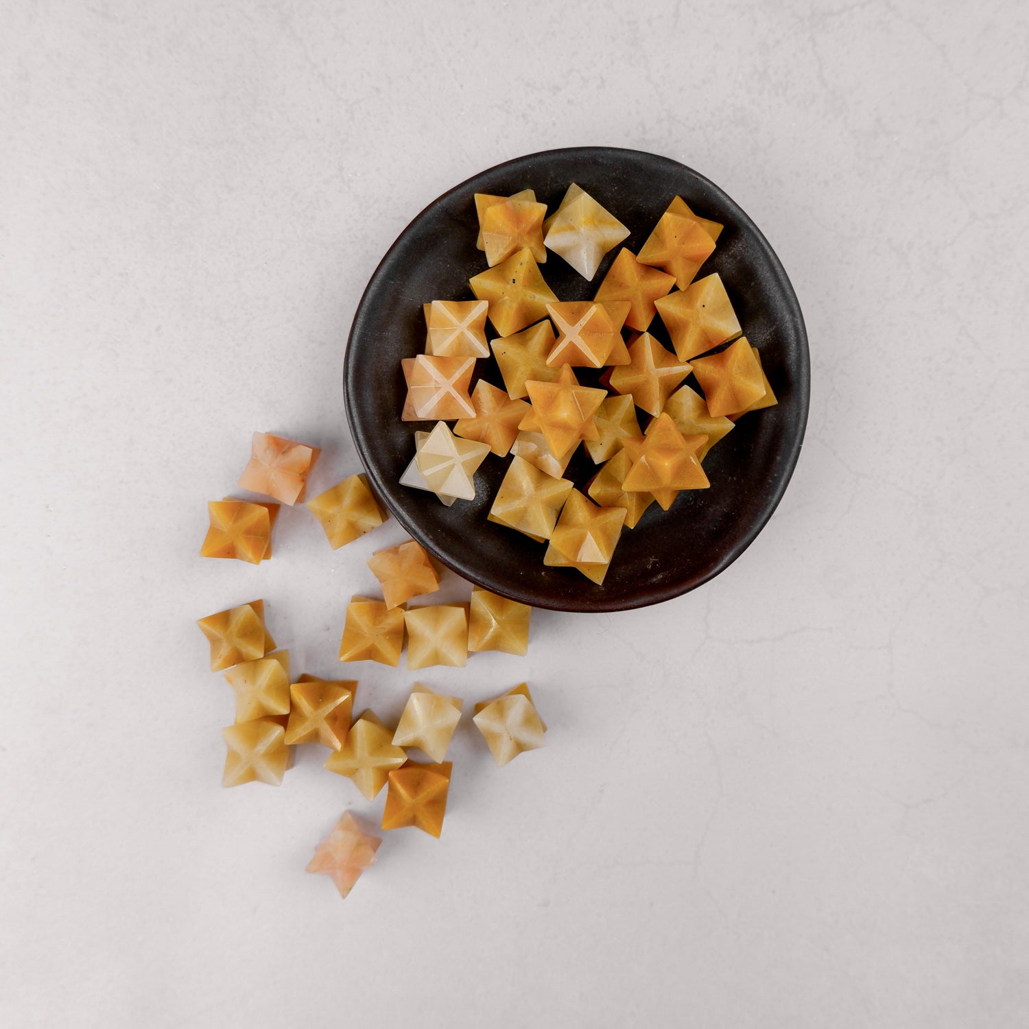 Yellow aventurine star crystal from Noctis Studio, featuring a polished star shape with vibrant yellow color and smooth surface.