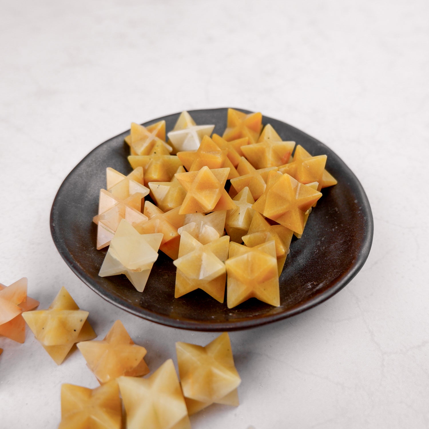 Yellow Aventurine star sculpture by Noctis Studio, featuring a smooth, polished star-shaped gemstone with vibrant yellow color and natural veining.