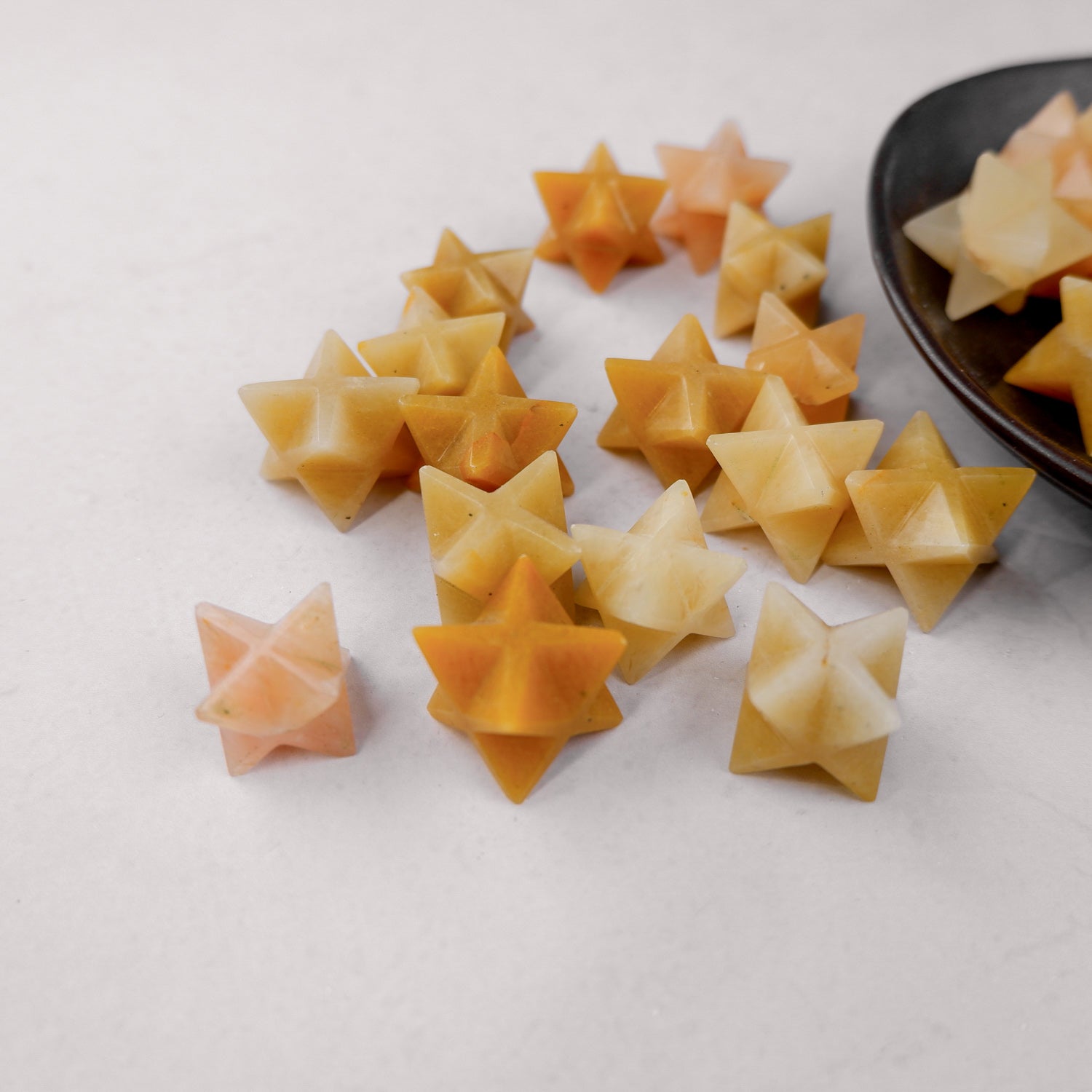 Yellow Aventurine star sculpture by Noctis Studio, featuring a polished, vibrant yellow gemstone star on a smooth surface.