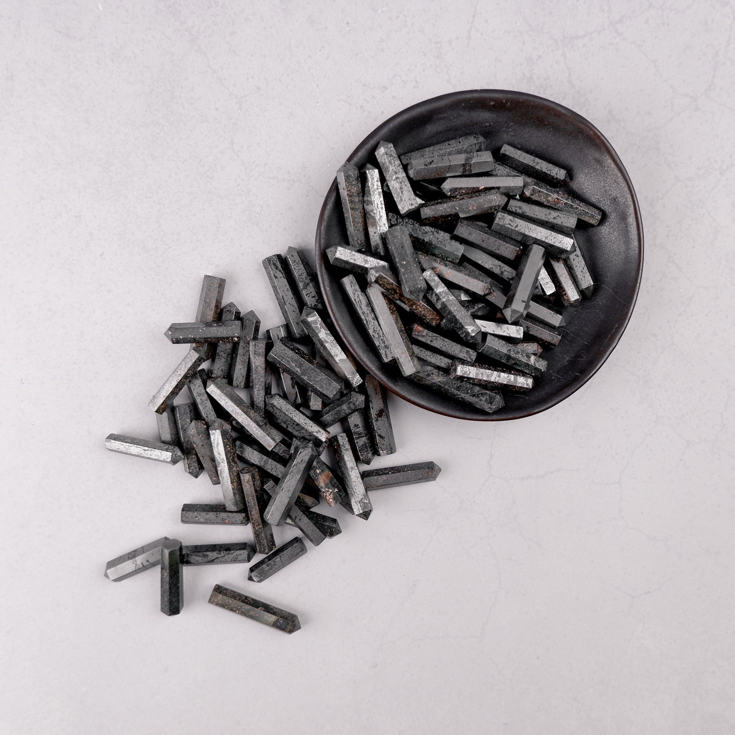 Hematite single gridding point by Noctis Studio, metal tool with a pointed tip for precise application or detailing.