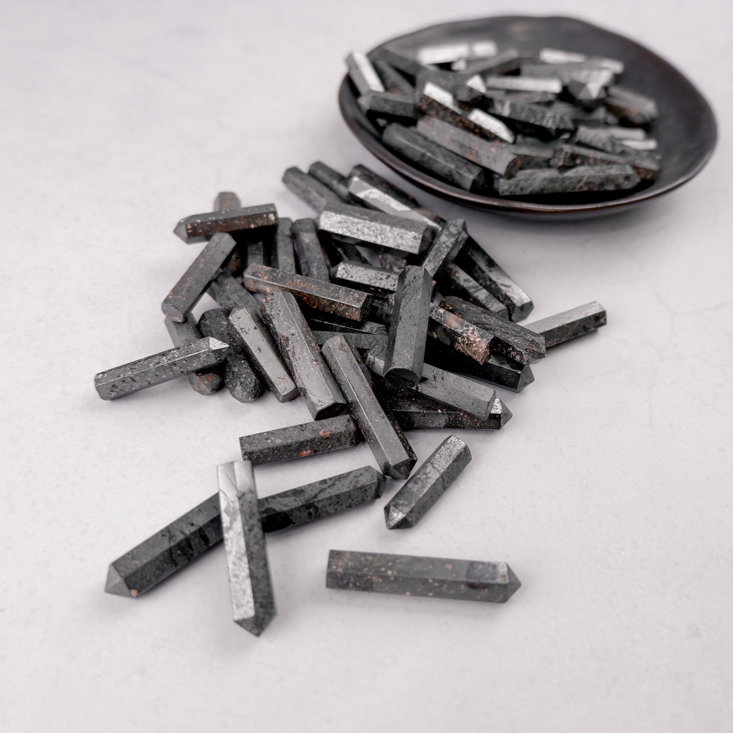 Hematite single gridding point by Noctis Studio, featuring a sleek metallic design used for crafting or jewelry making.