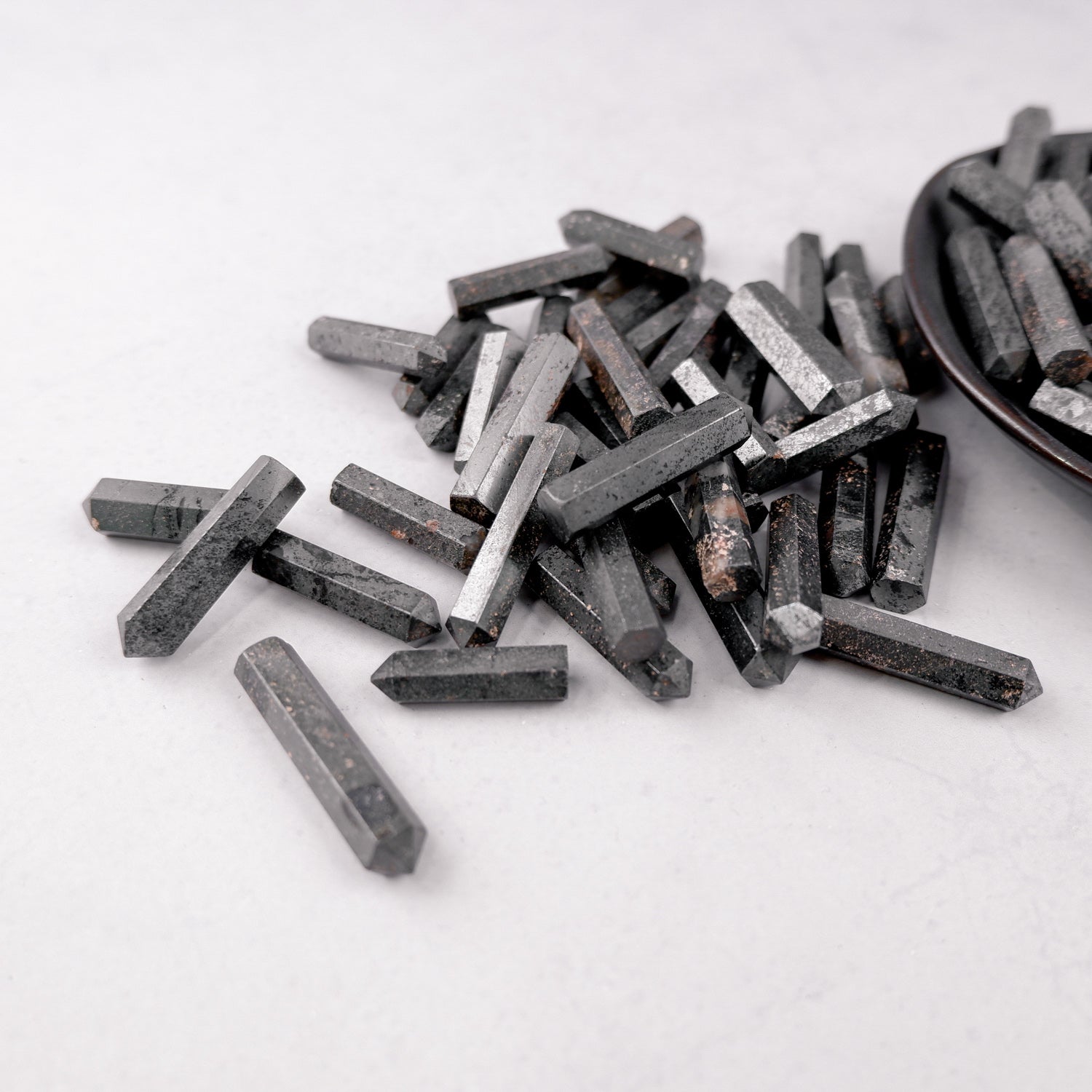 Hematite single gridding point from Noctis Studio, featuring a sleek, polished metal design used for crafting or jewelry making.