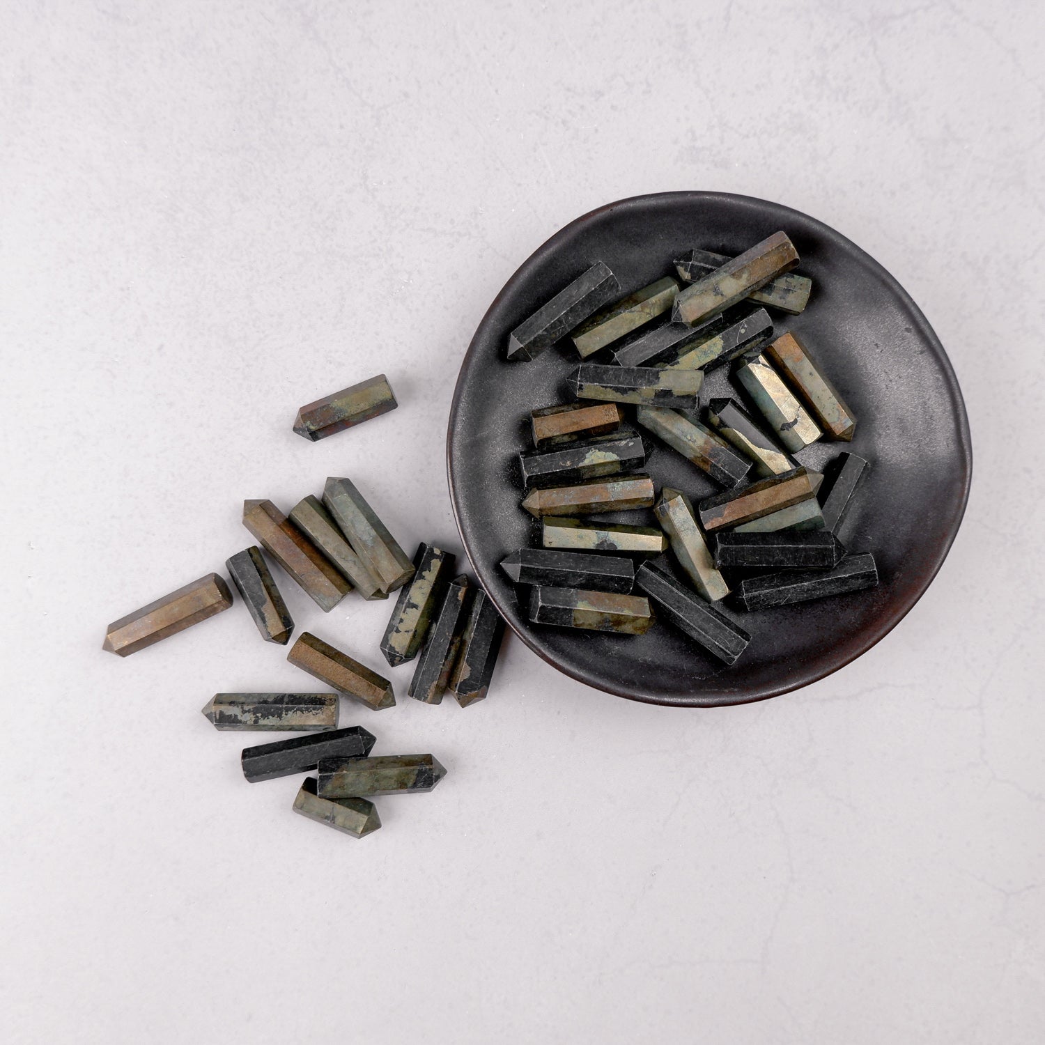 Noctis Studio Pyrite Single Gridding Point, a small metallic tool for crystal grid work, with a shiny pyrite finish.