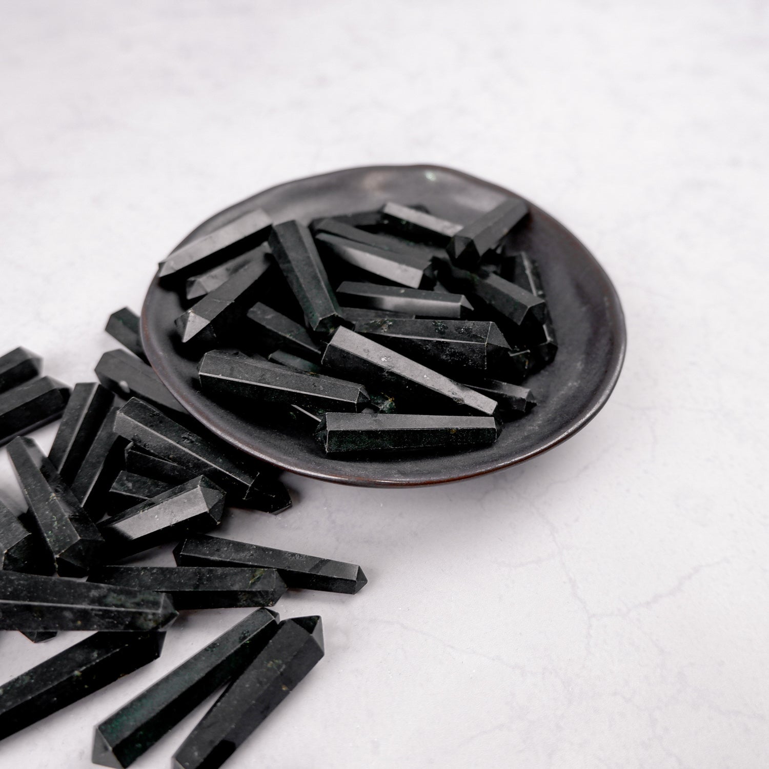 Black Tourmaline double gridding point by Noctis Studio, showcasing the polished mineral with pointed tips for healing and energy work.