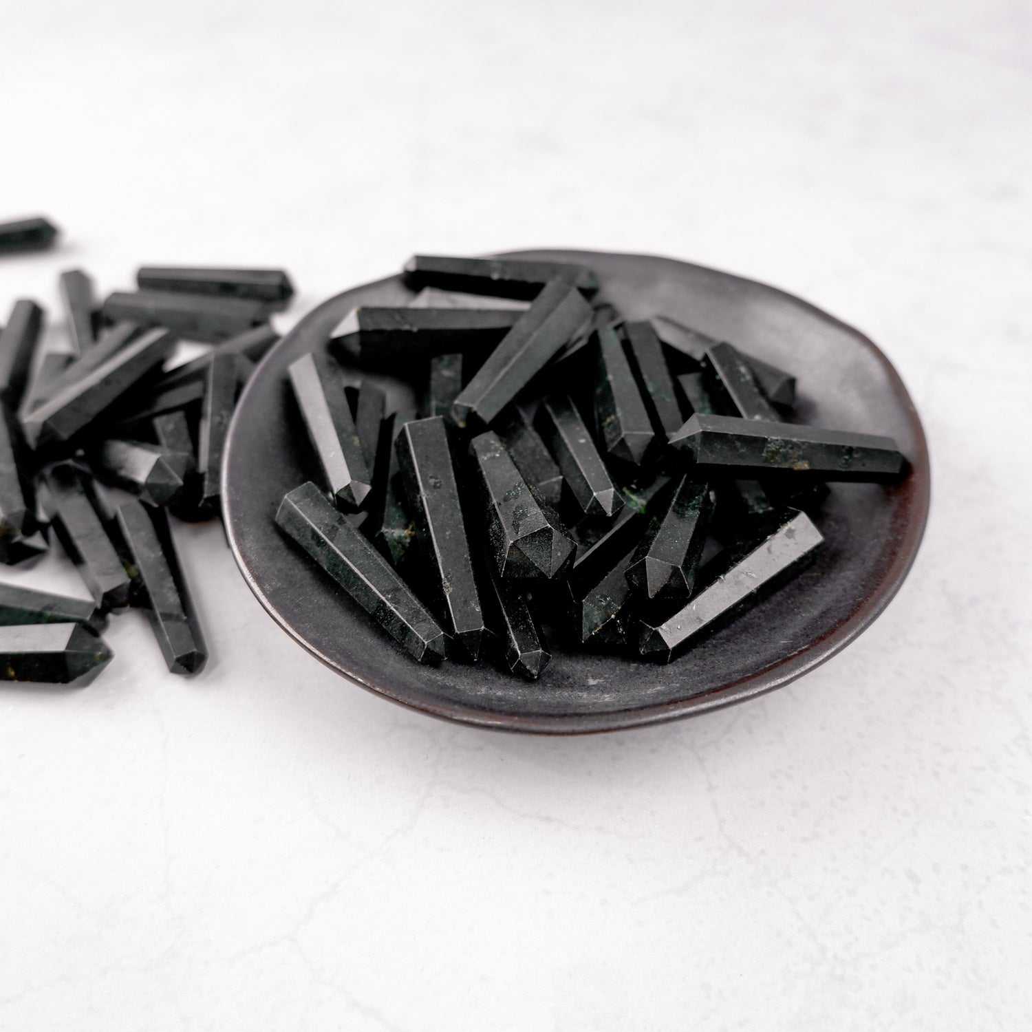 Black Tourmaline double gridding point from Noctis Studio, showcasing a polished, geometric healing crystal for energy balancing.