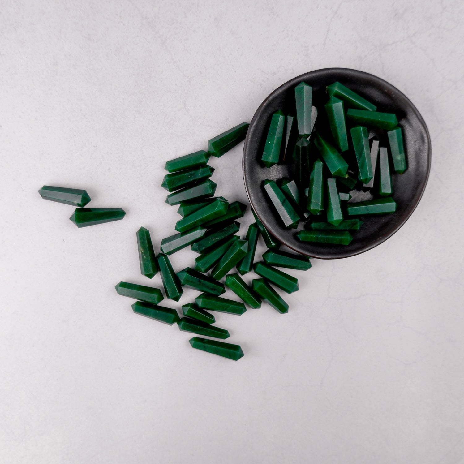 Dark green aventurine double gridding point from Noctis Studio, polished gemstone with pointed tip for crystal healing and energy work.