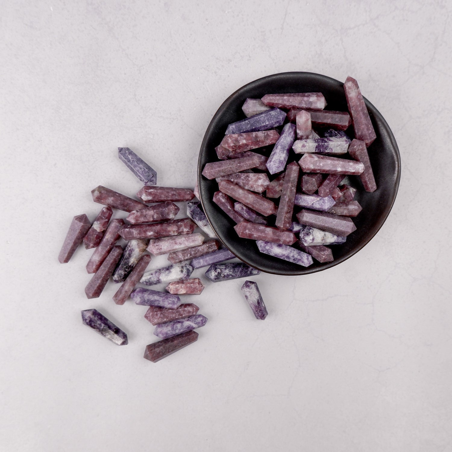 Lepidolite double gridding point from Noctis Studio, showcasing polished purple mineral with crystalline details.