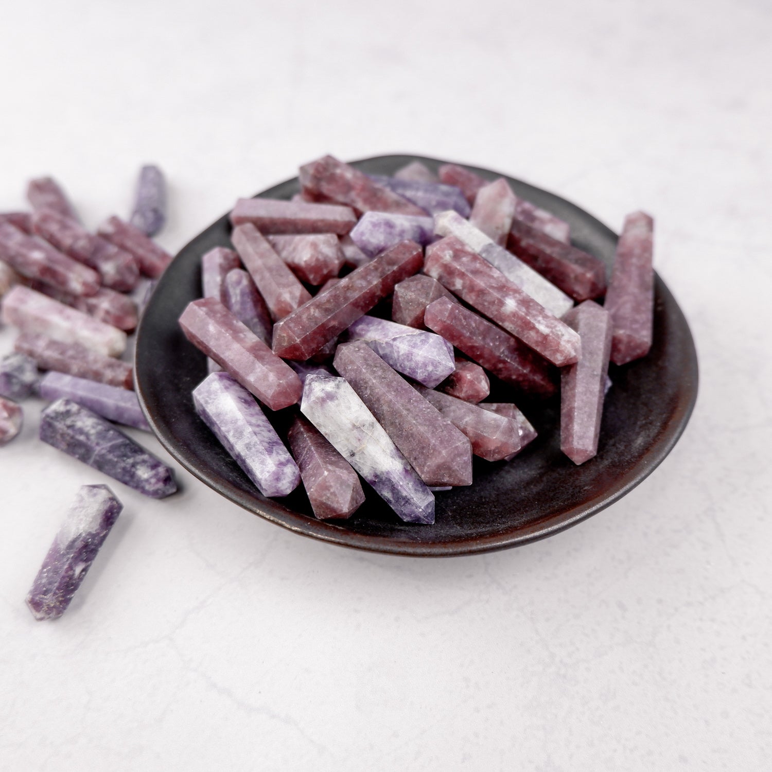 Lepidolite double gridding point from Noctis Studio, showcasing smooth purple and pink mineral crystal with natural veining.