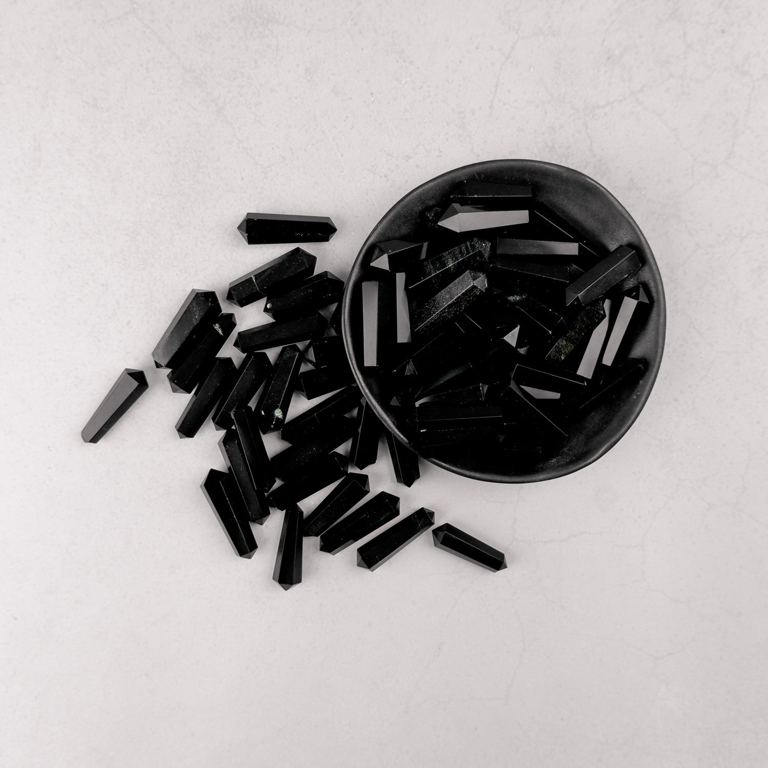 Obsidian Double Gridding Point by Noctis Studio, a detailed tool with dual point tips for precise gridding applications.