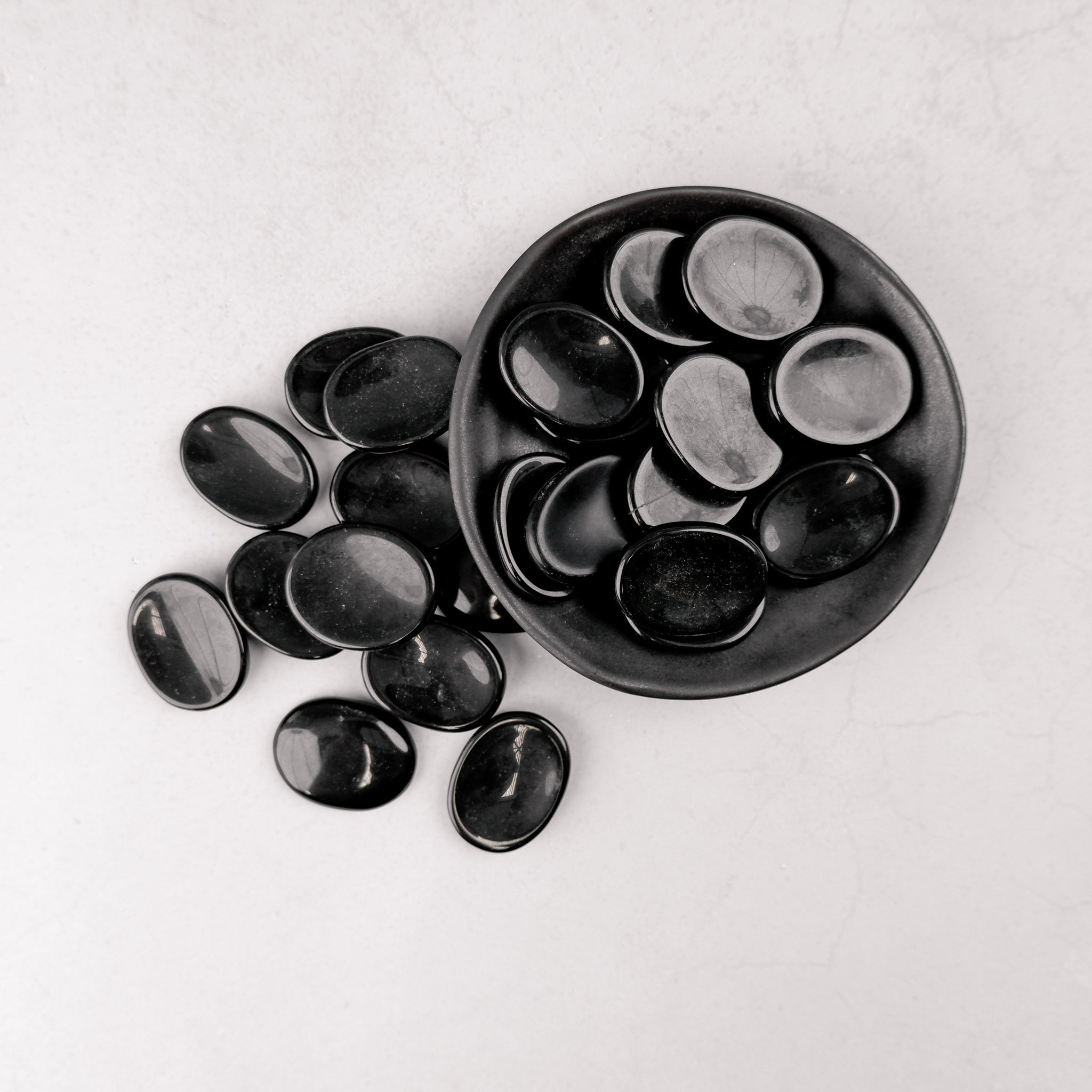 Black Jasper worry stone by Noctis Studio, smooth polished worry stone with natural black gemstone appearance.