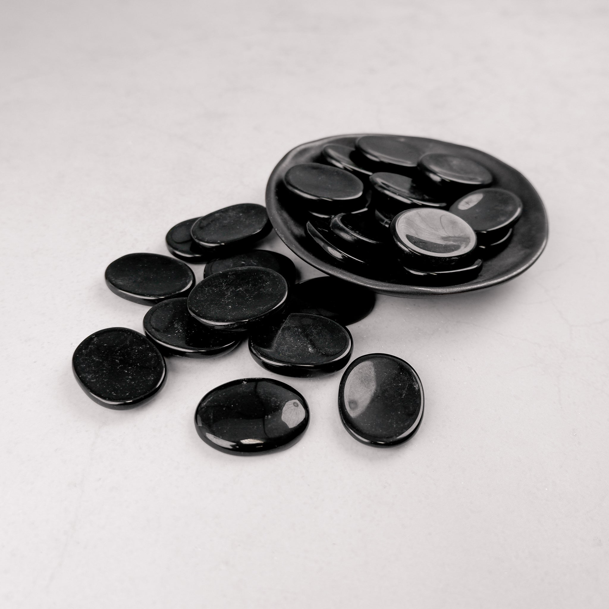 Black Jasper worry stone from Noctis Studio, smooth polished worry stone for stress relief and tactile comfort.