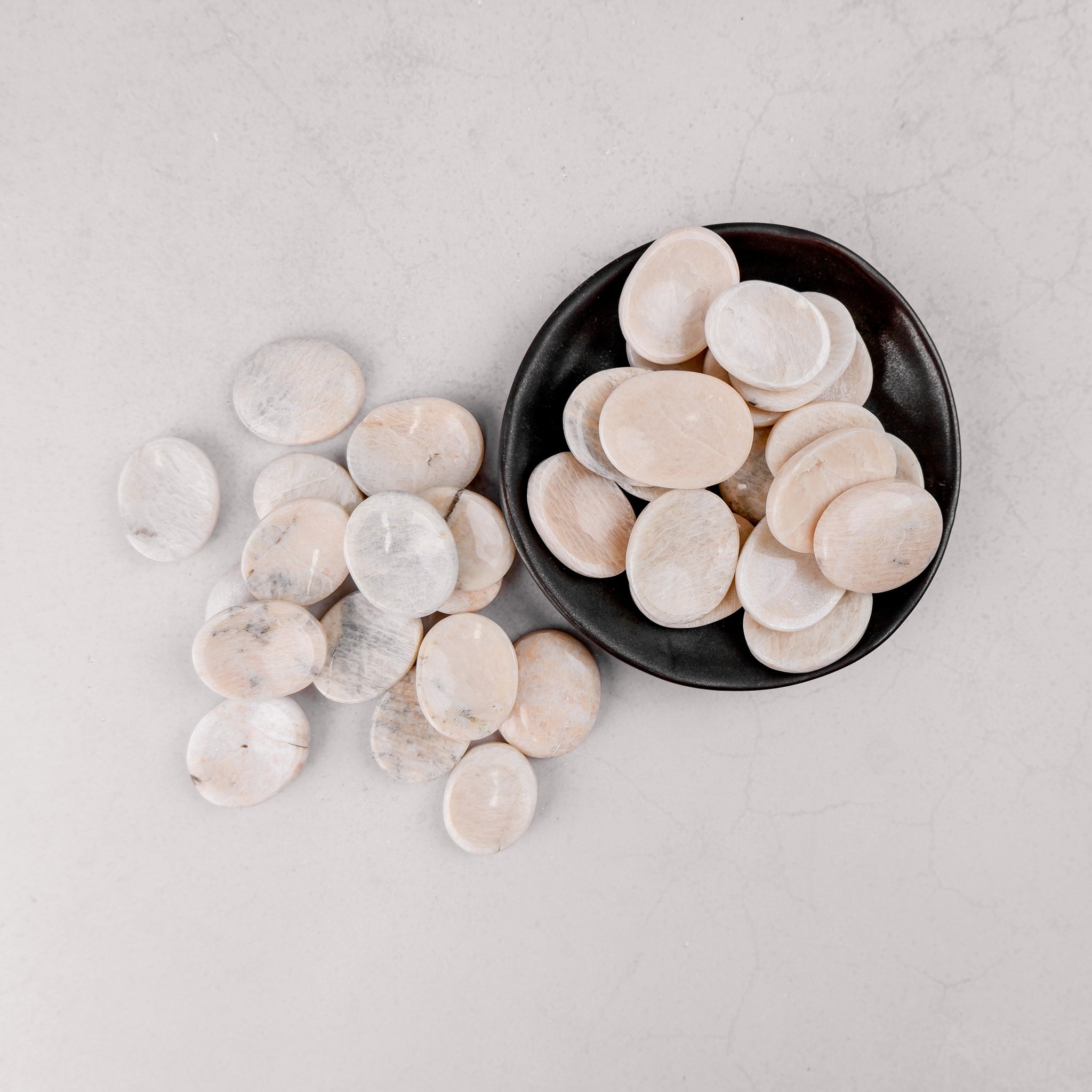 Cream moonstone worry stone from Noctis Studio with smooth, polished surface perfect for calming hand-held stress relief.