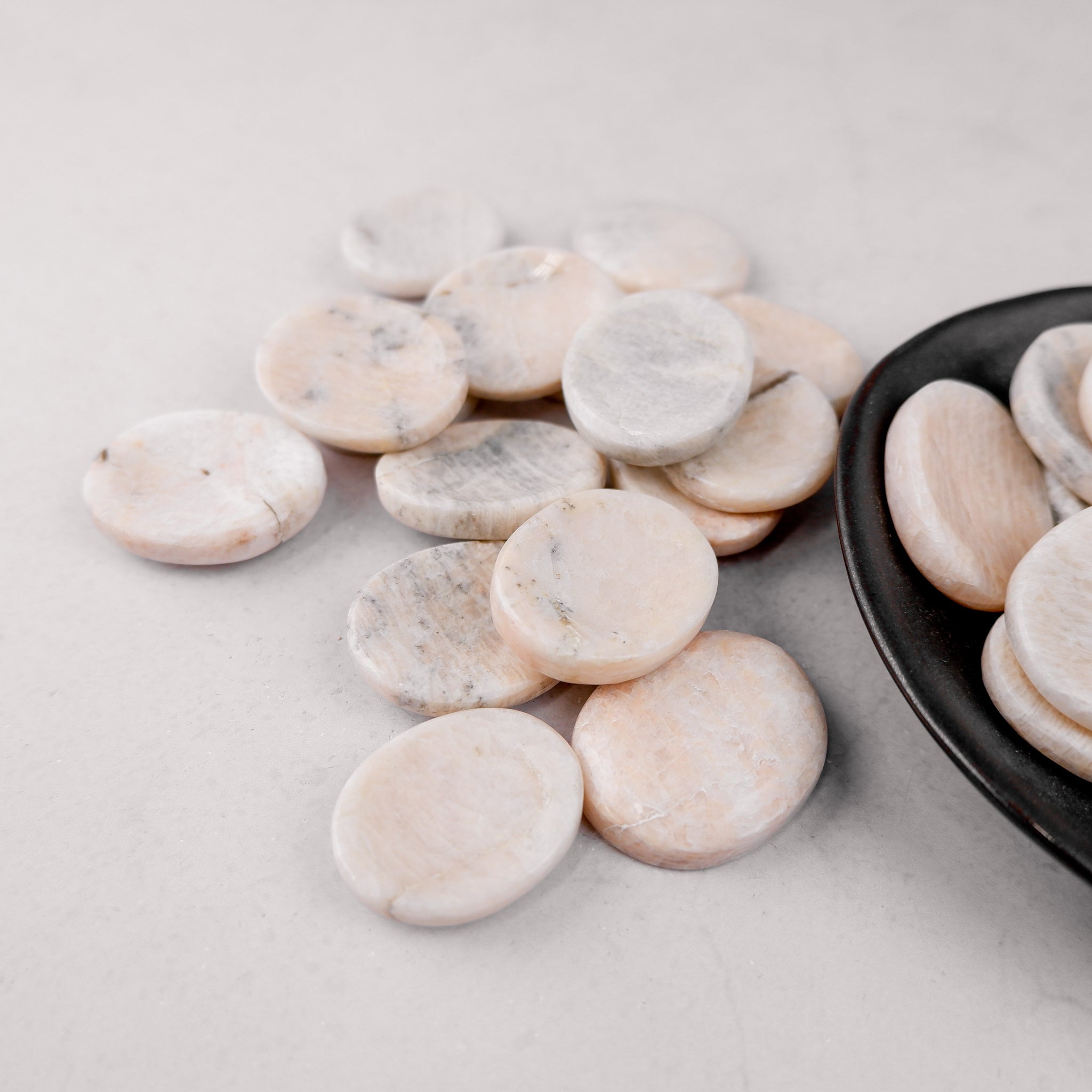 Cream moonstone worry stone from Noctis Studio, smooth oval-shaped gemstone for comfort and stress relief.