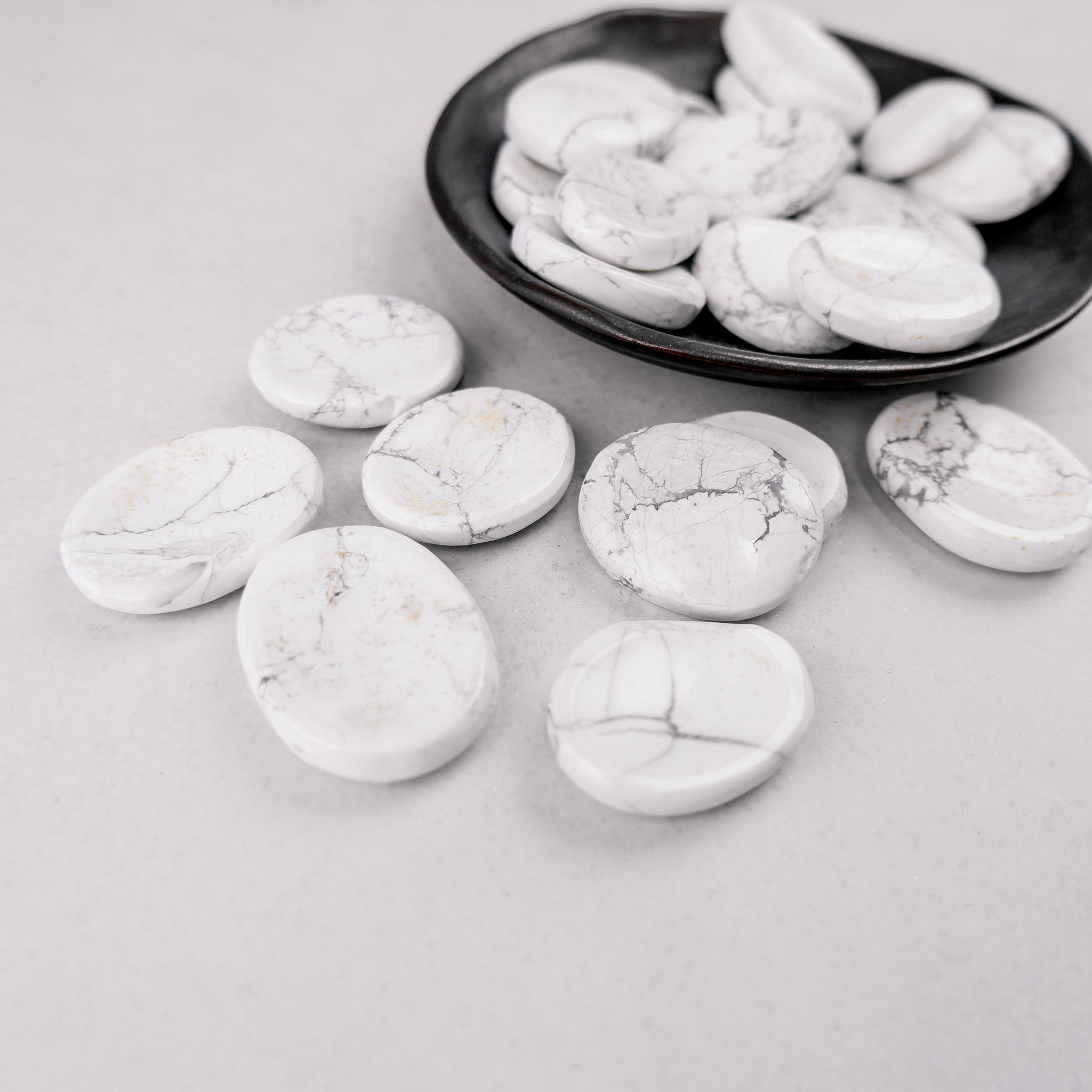 White Howlite worry stone by Noctis Studio, smooth polished gemstone for calming stress and enhancing mindfulness.