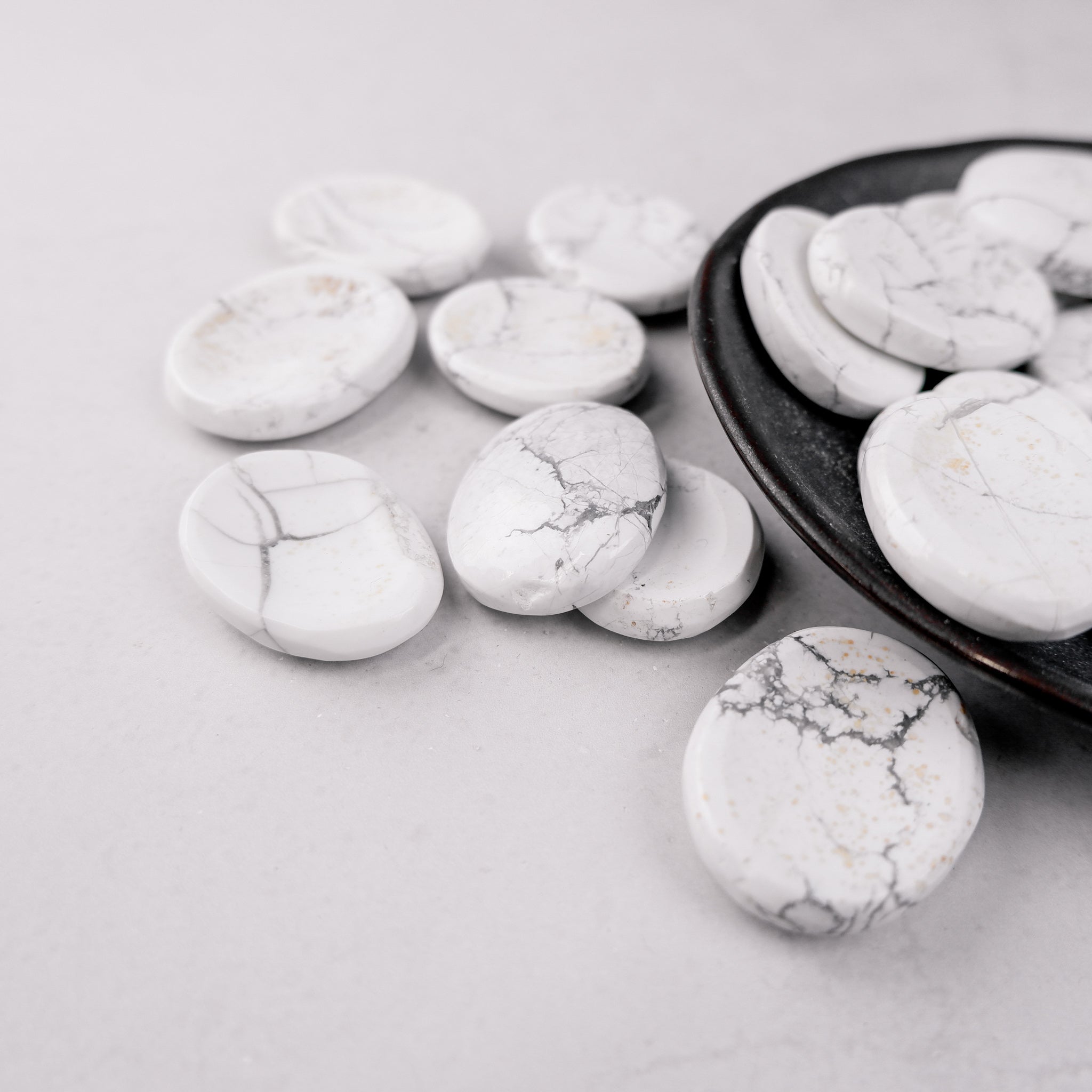 White Howlite worry stone from Noctis Studio, smooth polished gemstone for stress relief and calming touch.