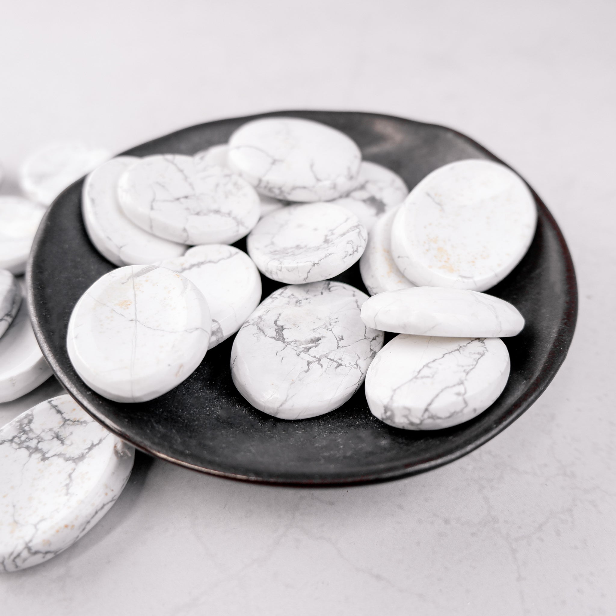 White Howlite worry stone from Noctis Studio, smooth polished gemstone for stress relief and calming touch.