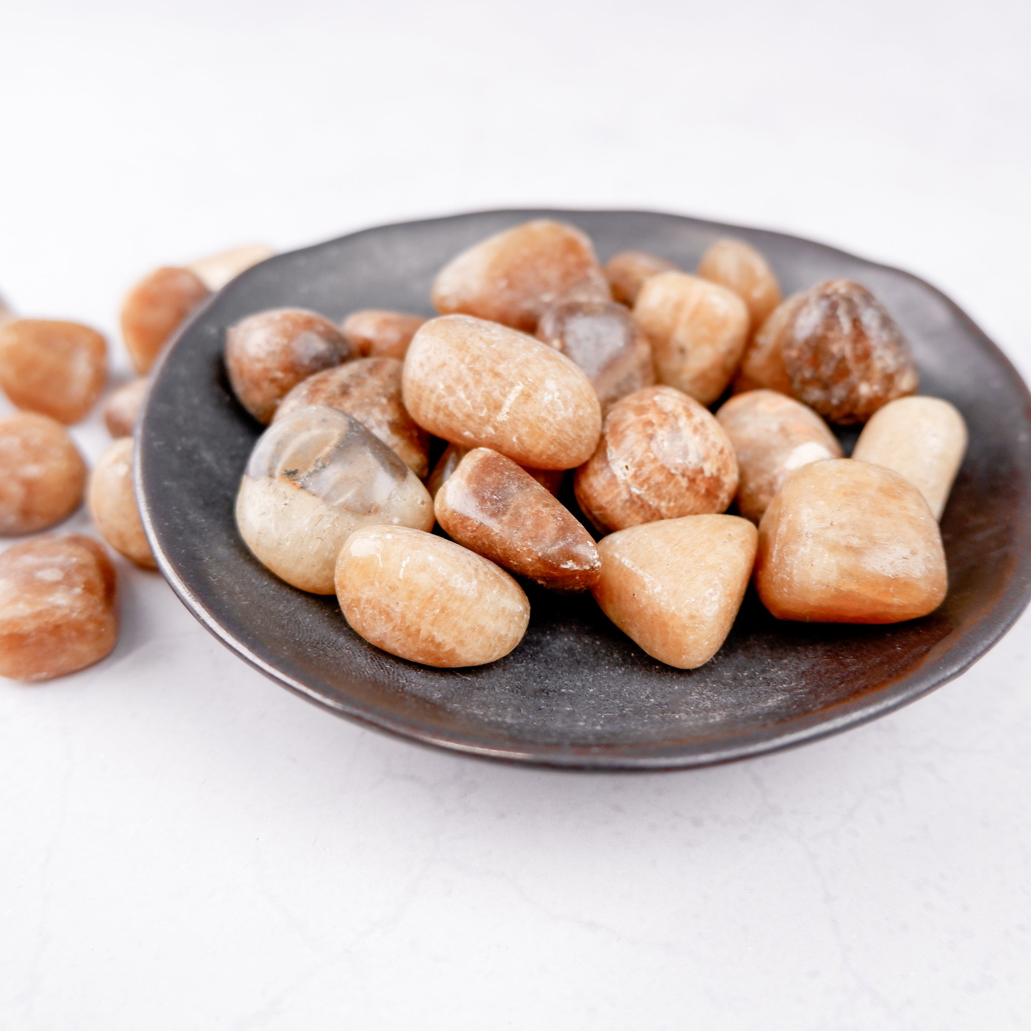 Noctis Studio Aragonite tumble stone showing natural earthy tones and polished surface, ideal for collection or healing practices.