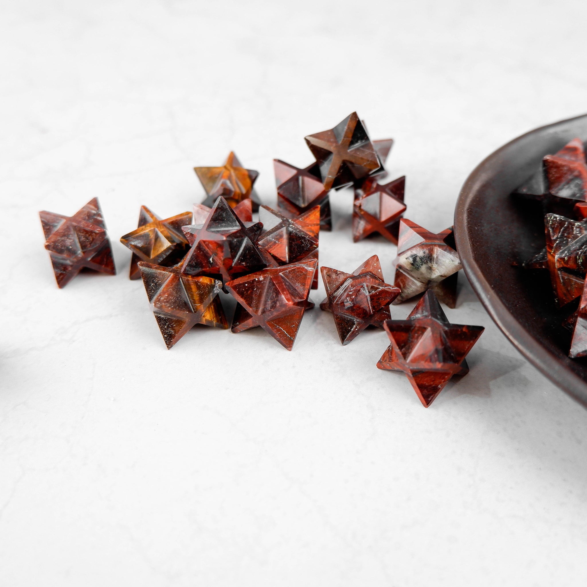 Red Tigers Eye Star pendant by Noctis Studio, featuring a polished star-shaped gemstone with rich red and brown tones.