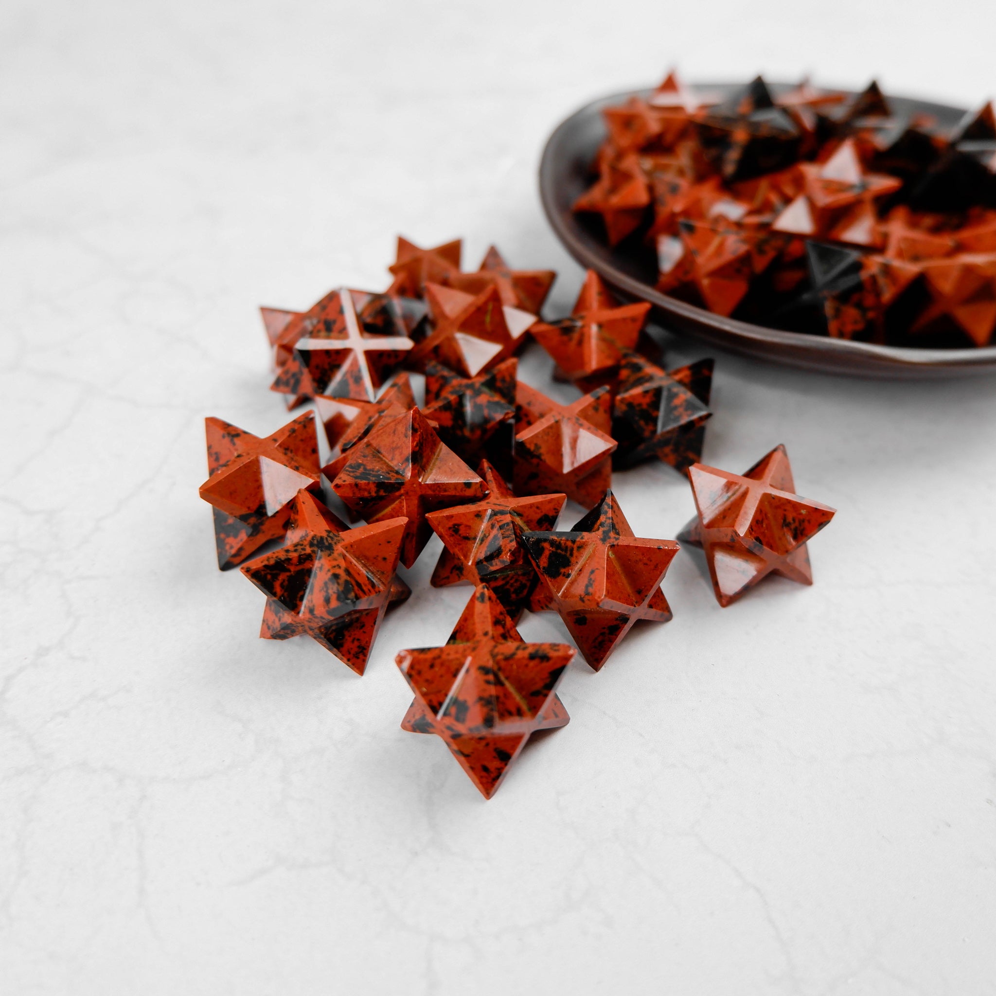 Noctis Studio Mahogany Obsidian star sculpture with polished, natural stone surface and distinct star shape for decorative display.