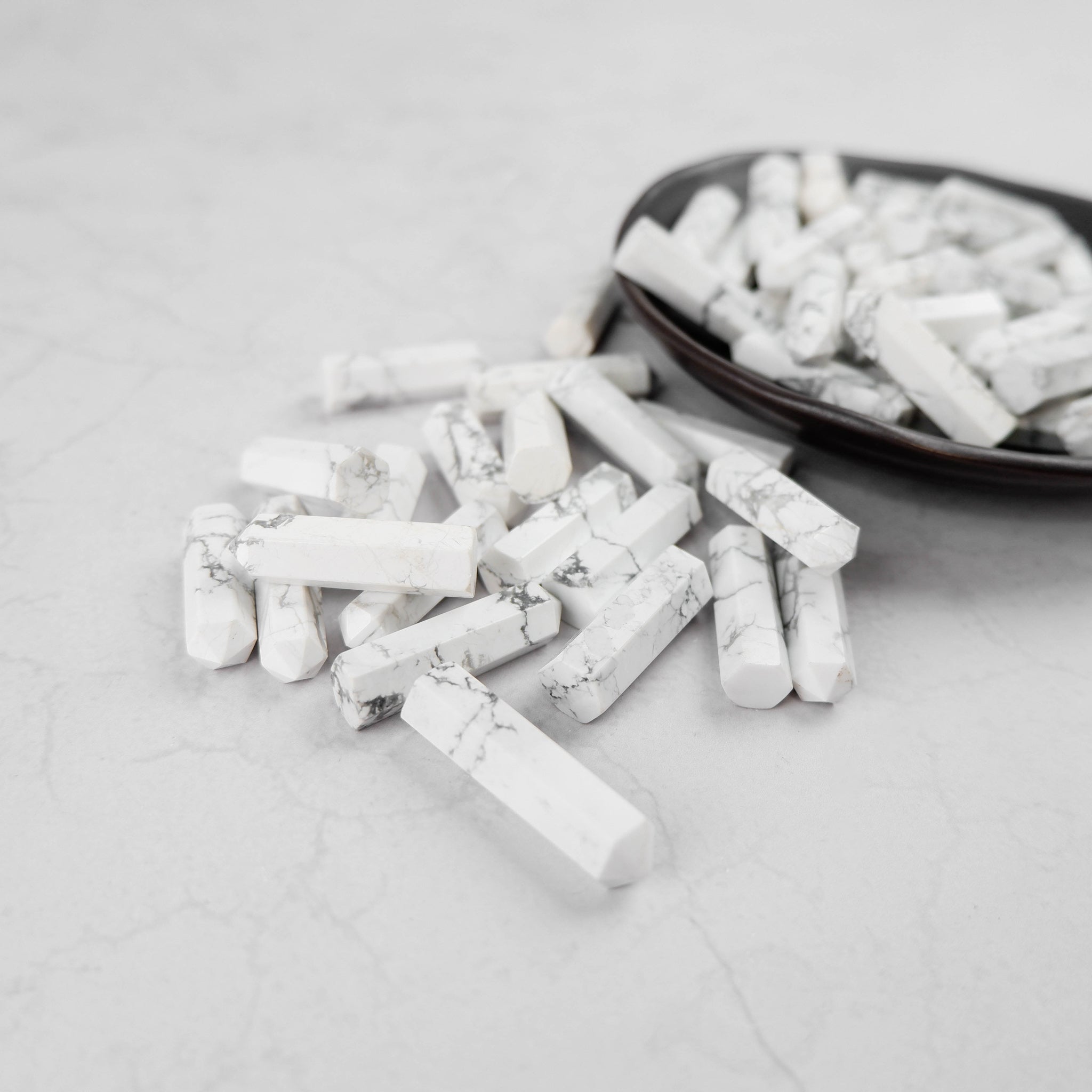 White Howlite single gridding point from Noctis Studio, smooth polished stone for crystal grid layouts and spiritual practices.