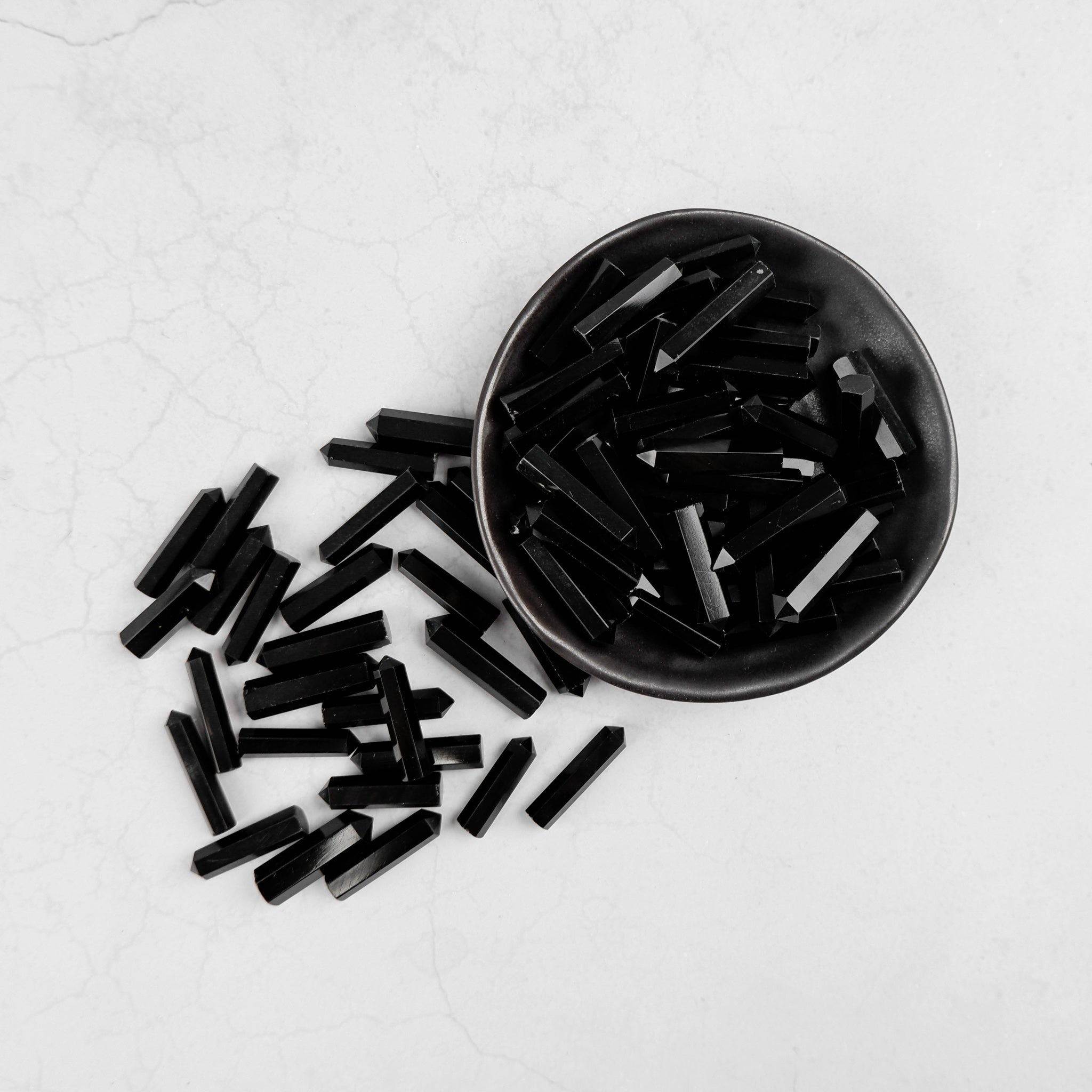 Noctis Studio obsidian single gridding point for precise gemstone setting, displayed on a neutral background.