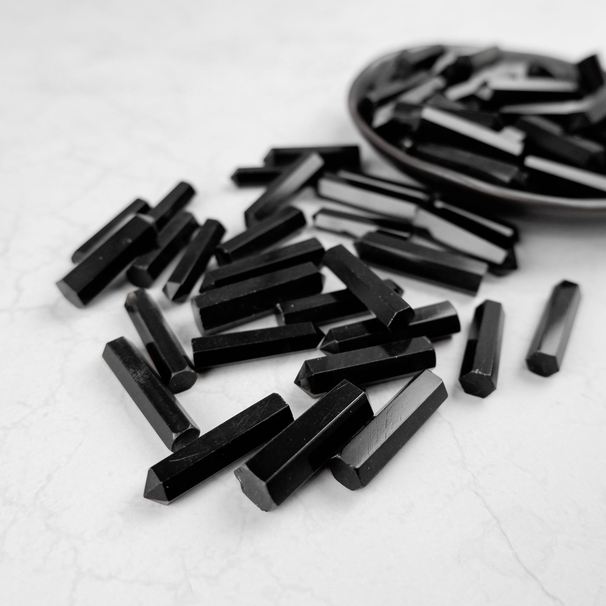 Obsidian single gridding point by Noctis Studio, featuring a sleek black design for precise application and detailing.