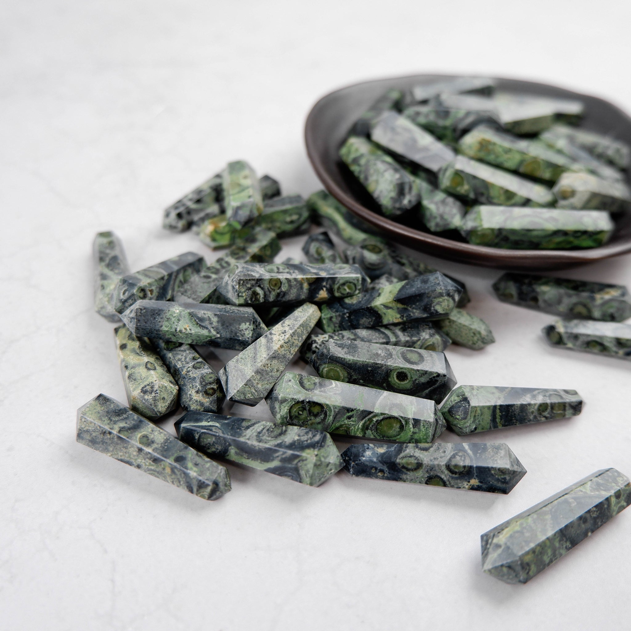 Noctis Studio Kambaba Jasper Double Gridding Point, polished gemstone healing crystal with green and black patterns.