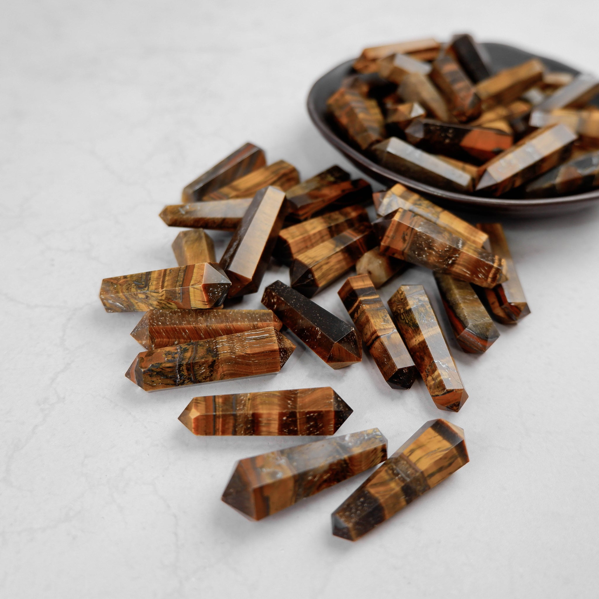 Noctis Studio Tigers Eye Double Gridding Point, a precision tool with tiger's eye design for crafting or jewelry making.