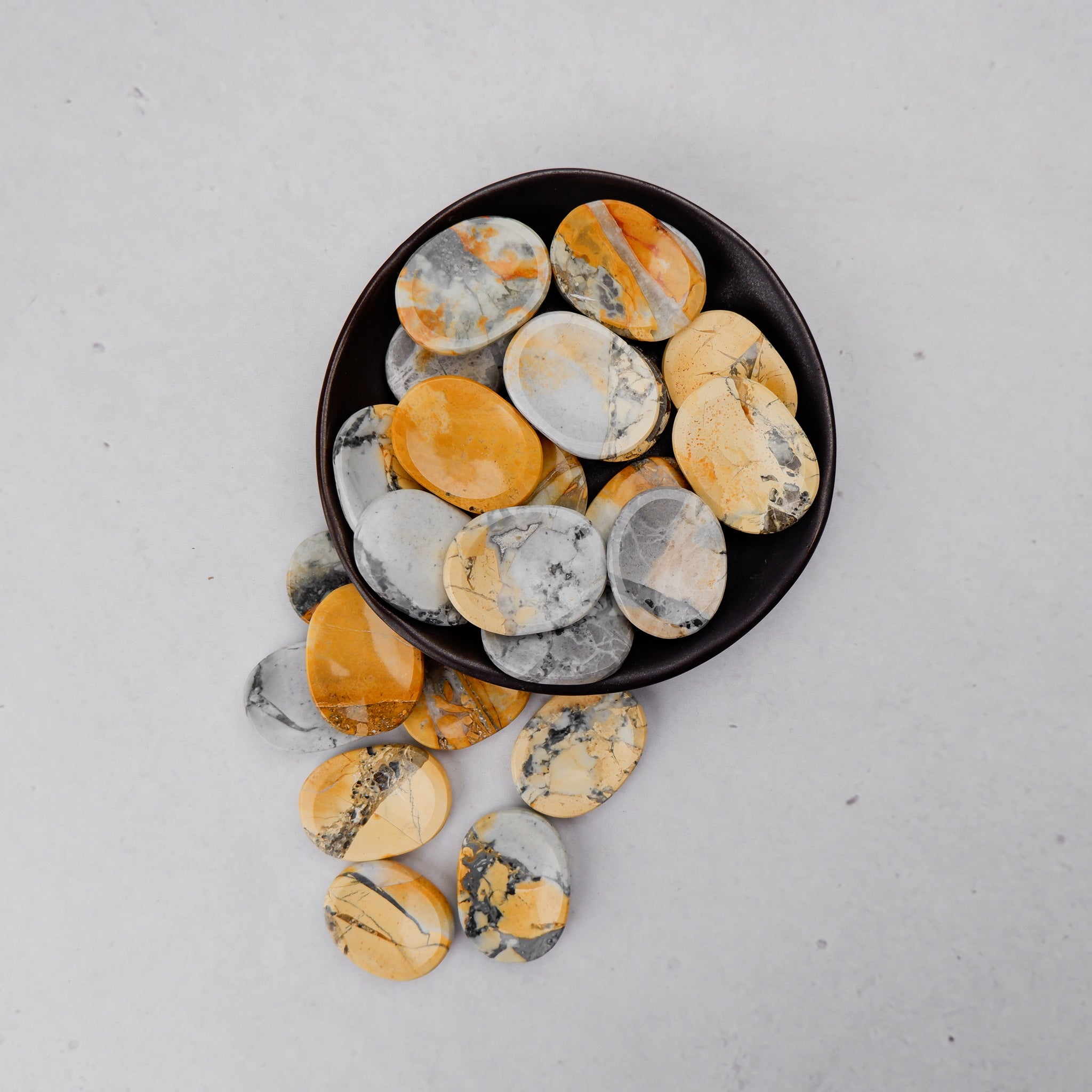 Maligano Jasper worry stone from Noctis Studio, polished gemstone with natural earthy patterns and smooth surface for stress relief.