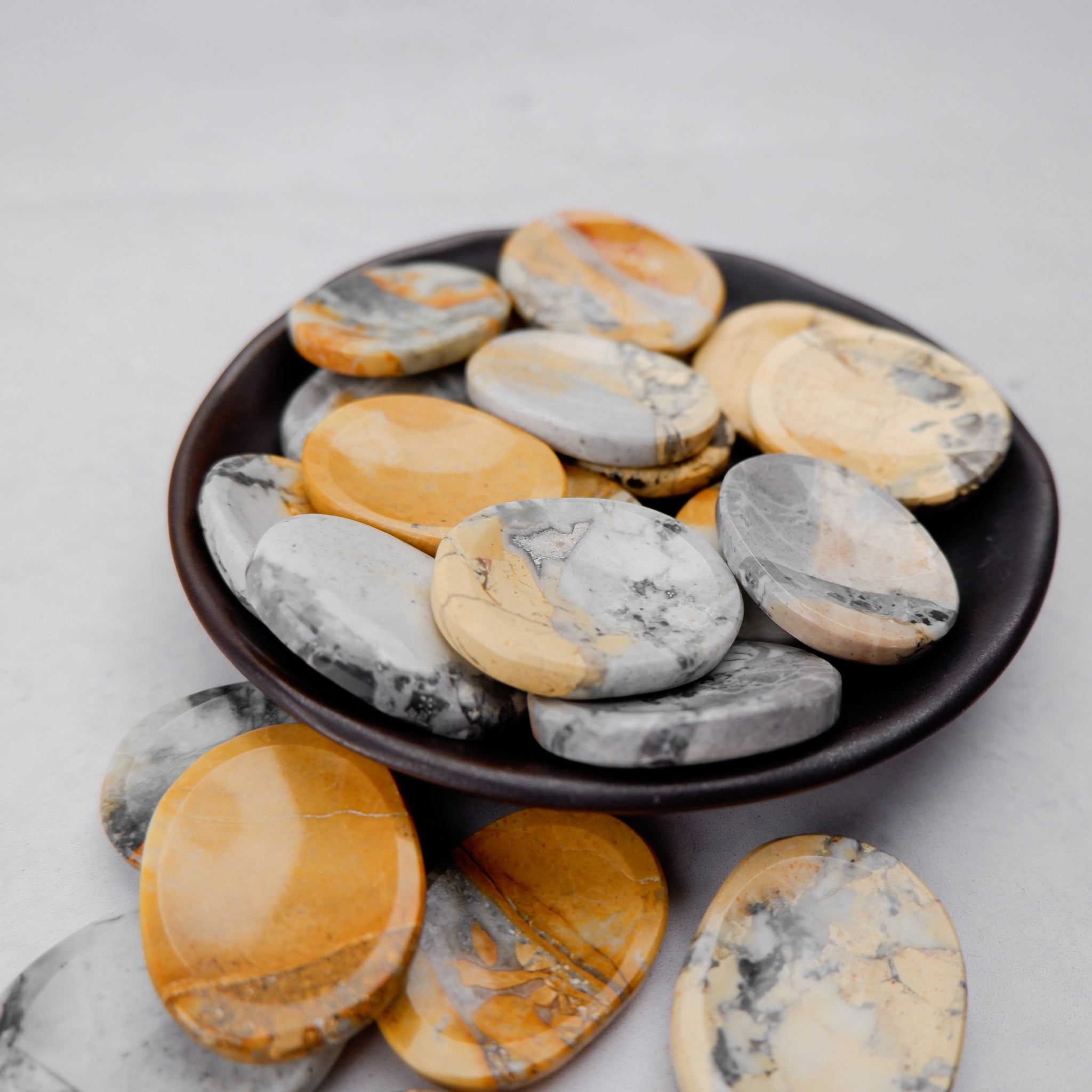 Maligano Jasper worry stone by Noctis Studio, smooth polished gemstone with natural earthy patterns and rounded shape.