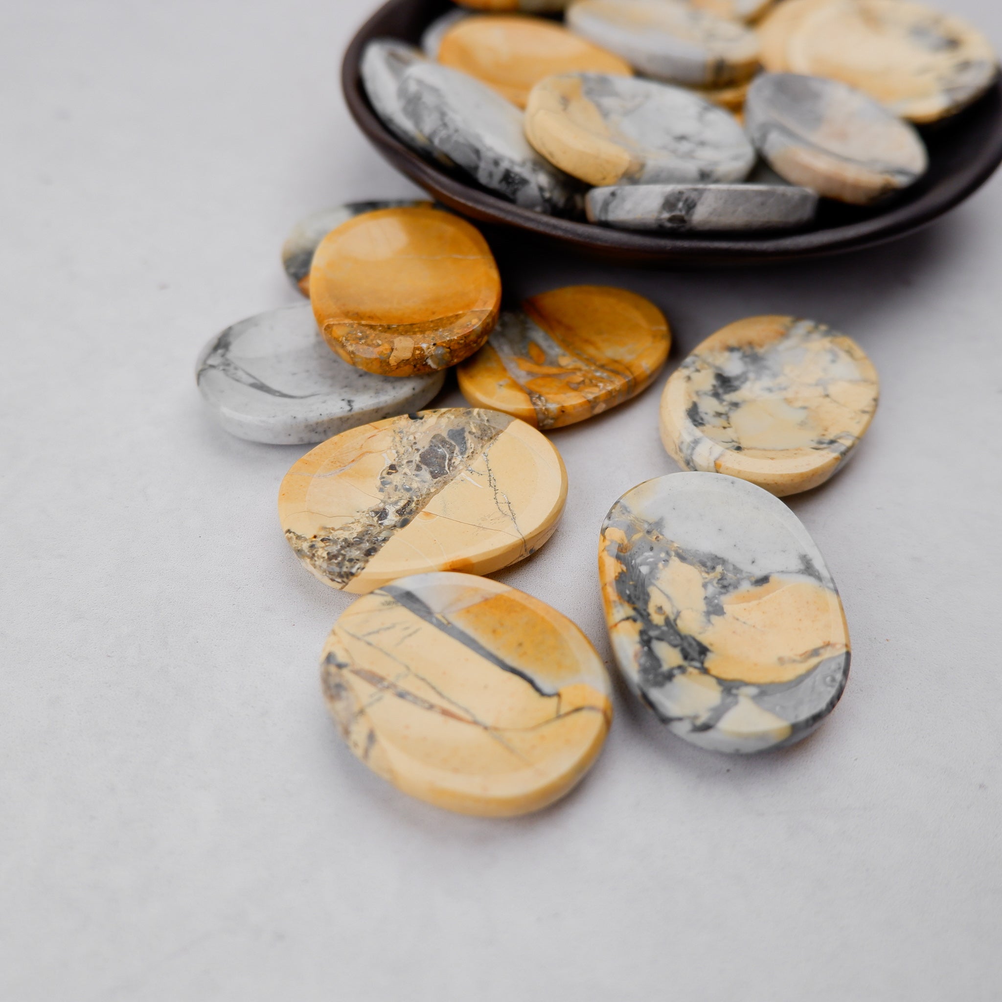 Maligano Jasper worry stone from Noctis Studio, smooth polished gemstone for stress relief and meditation.