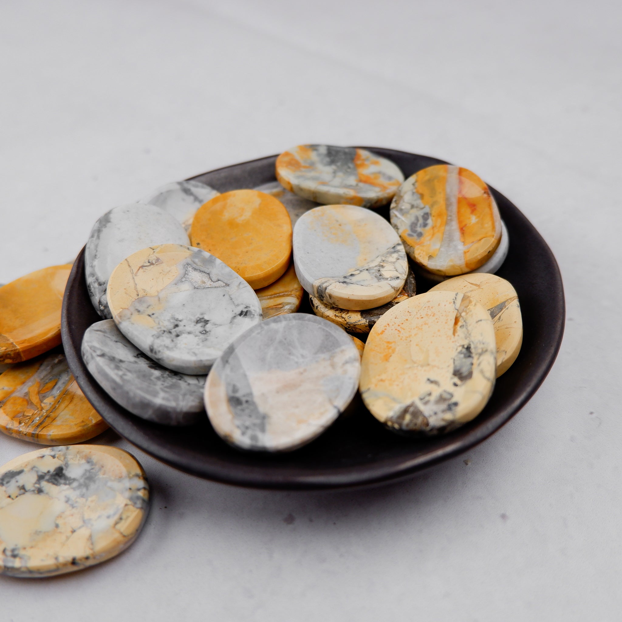 Noctis Studio Maligano Jasper worry stone, smooth polished gemstone for stress relief and meditation, shown on a neutral background.