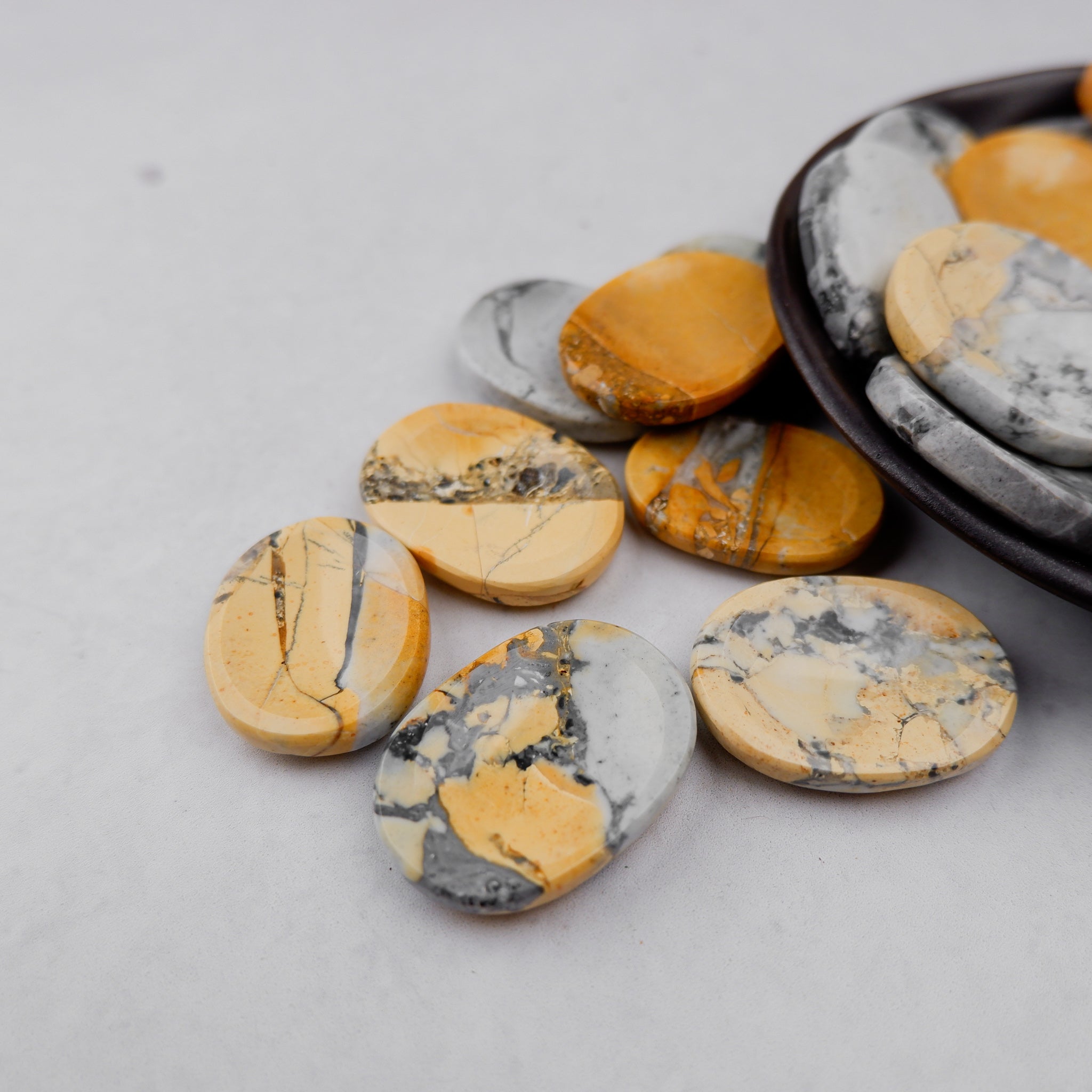 Noctis Studio Maligano Jasper worry stone with smooth polished surface and natural earthy tones, used for stress relief or meditation.