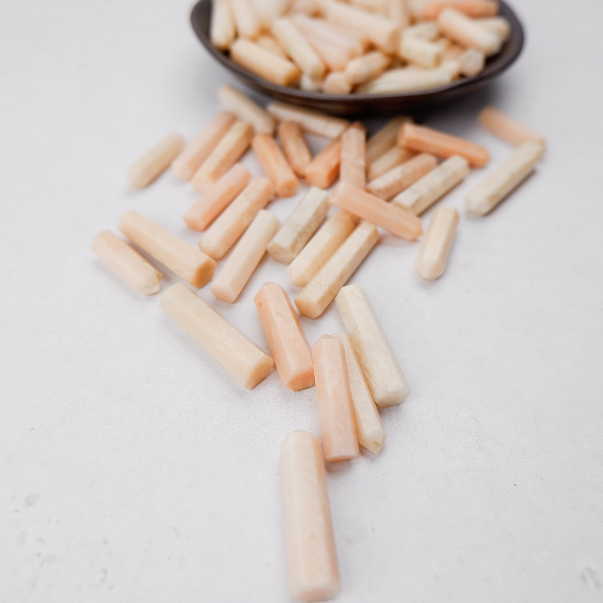 Cream moonstone single gridding point by Noctis Studio, featuring a smooth, polished cream-colored moonstone with a pointed tip.
