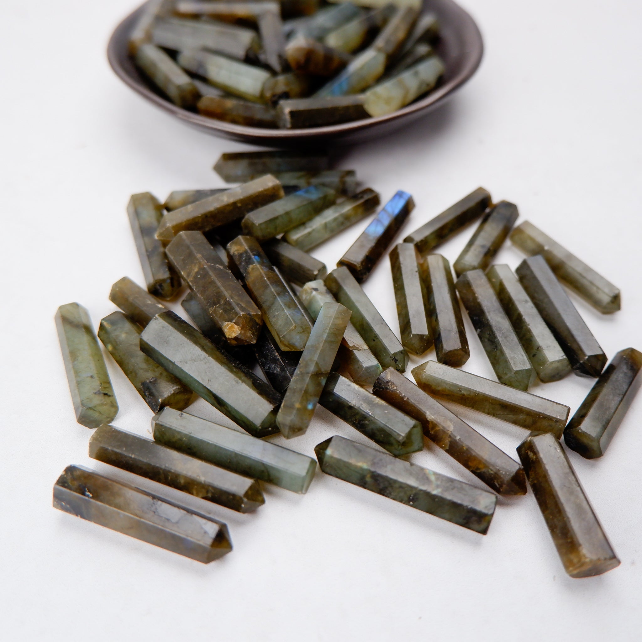 Labradorite single gridding point from Noctis Studio, featuring iridescent flashes and natural stone shape for crystal healing and decor.