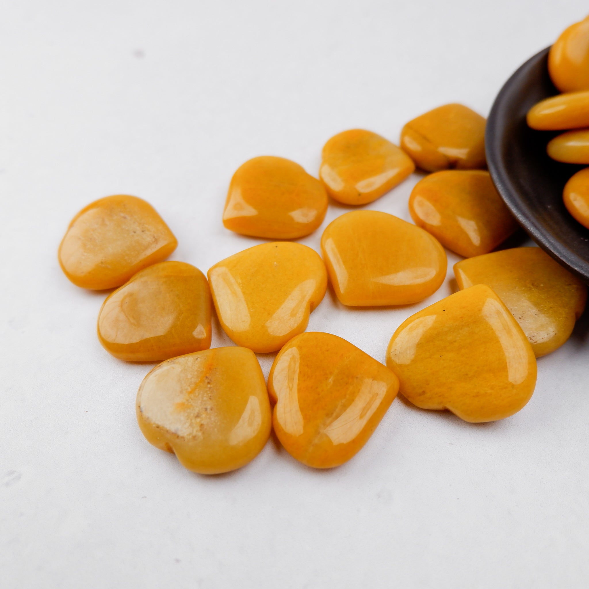 Yellow Aventurine heart gemstone from Noctis Studio, polished and smooth, showcasing its vibrant yellow color and natural veining.
