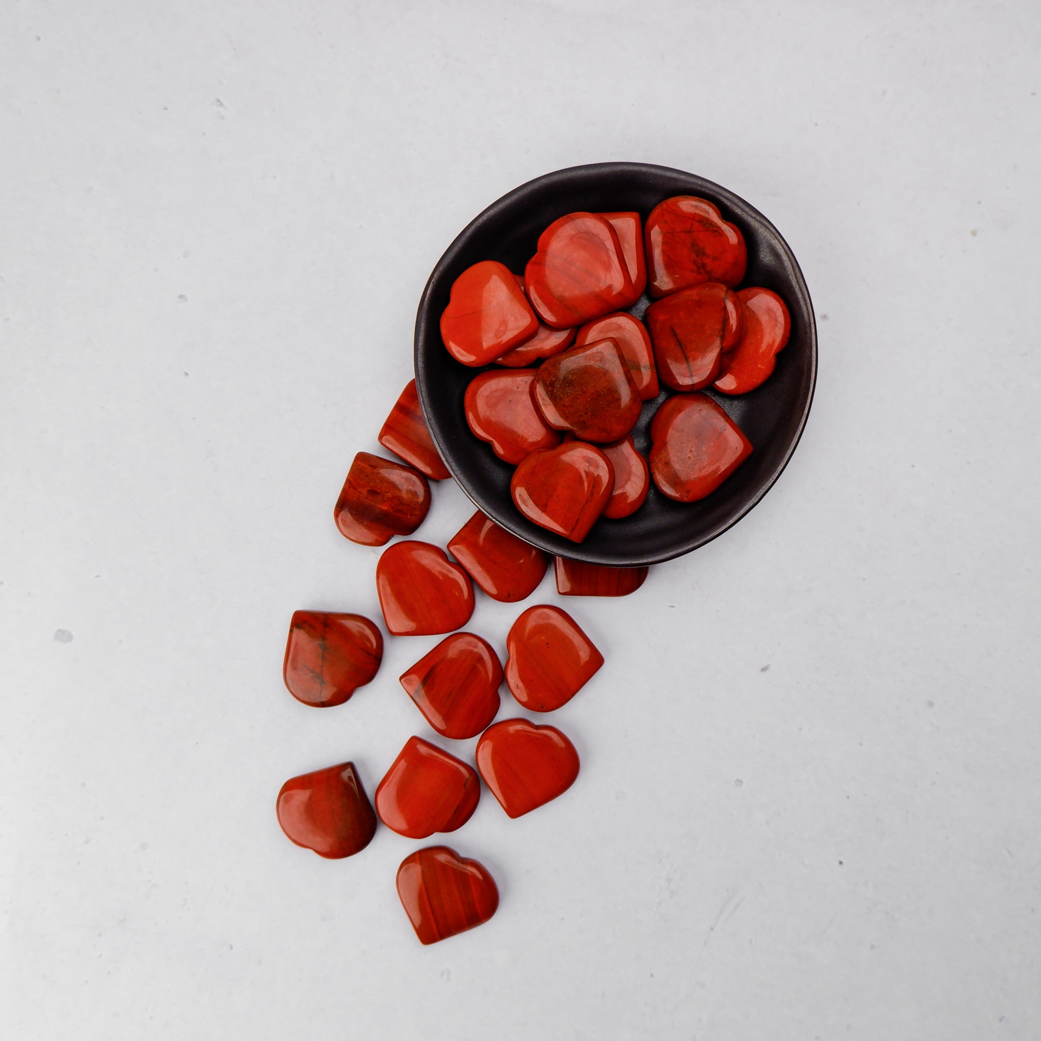 Red Jasper Heart by Noctis Studio featuring a polished, vibrant red gemstone heart with natural patterns and smooth surface.