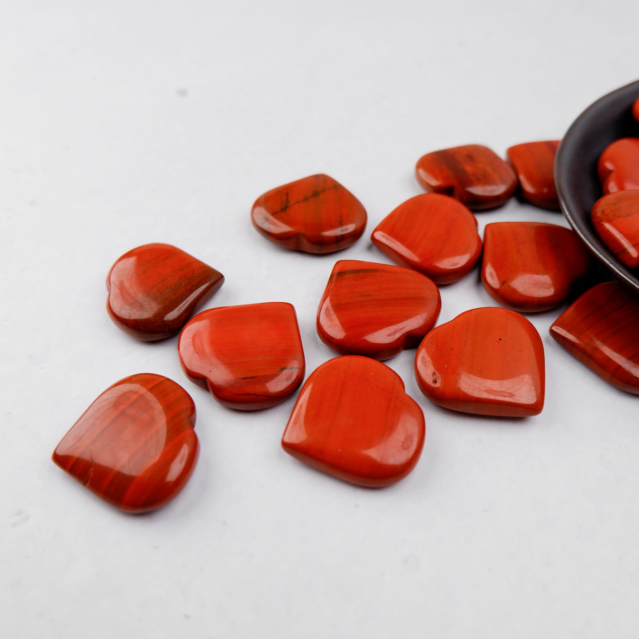 Red Jasper heart gemstone from Noctis Studio, polished and smooth with rich red and earthy tones.