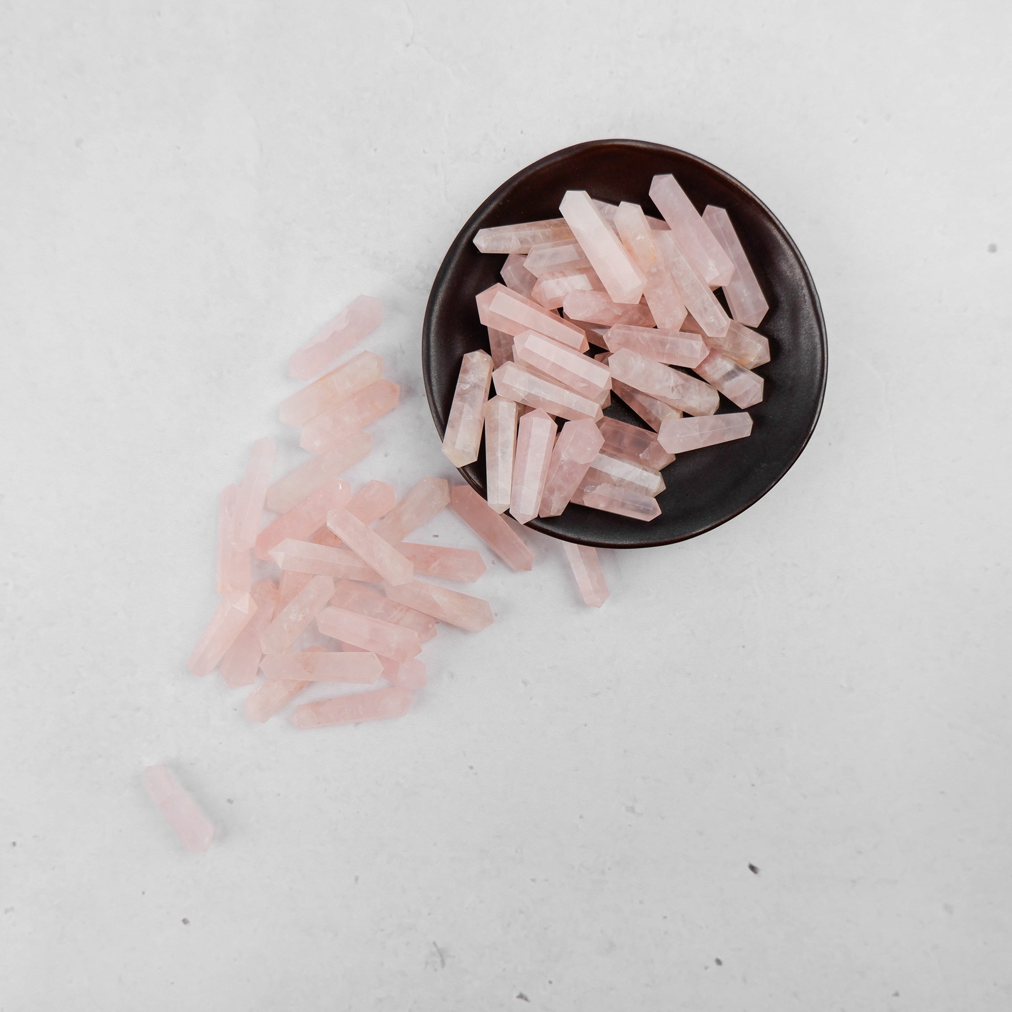 Rose Quartz double gridding point by Noctis Studio, showcasing a polished crystal tool used for skincare or energy work.