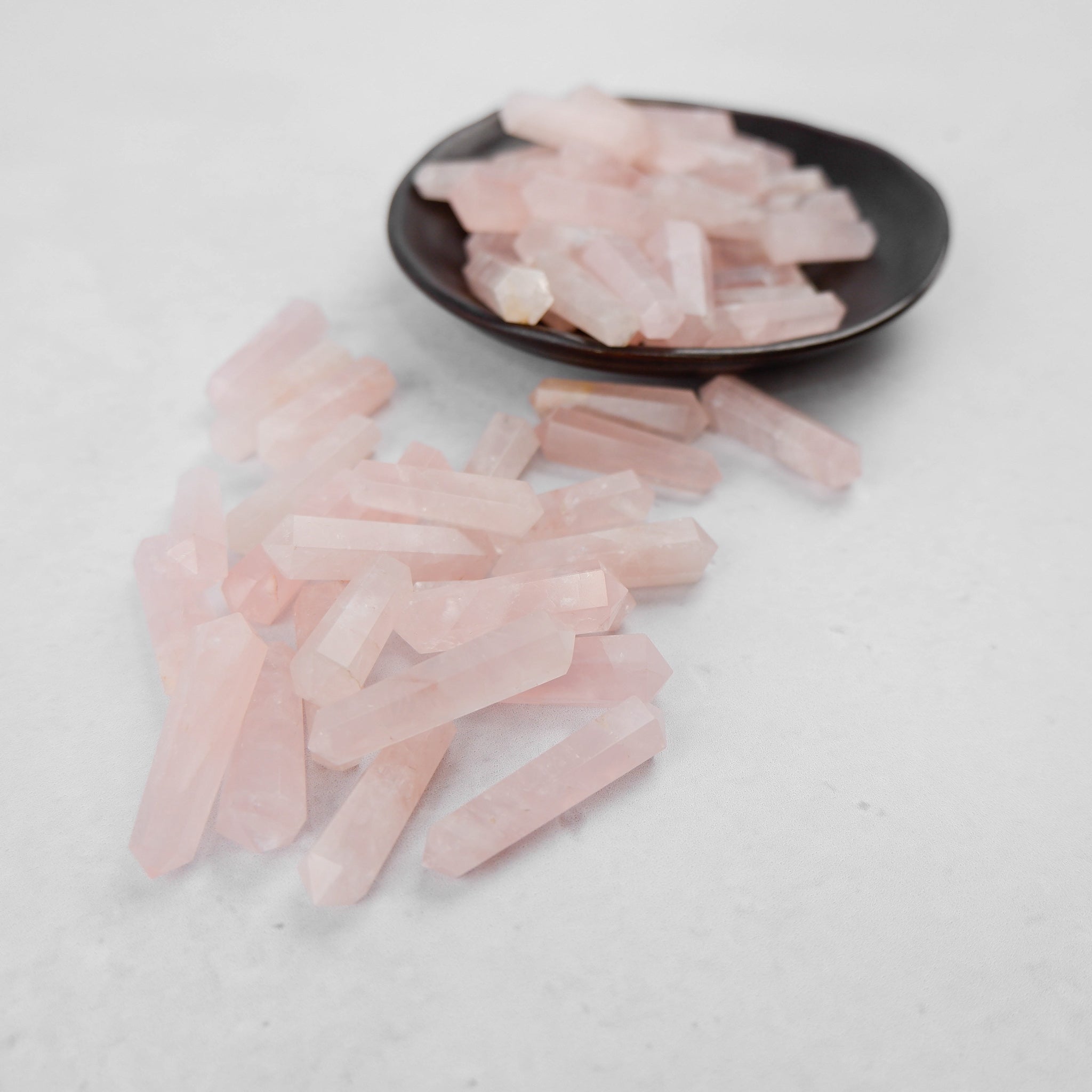 Noctis Studio Rose Quartz Double Gridding Point, smooth pink gemstone tool for facial and skincare treatments.